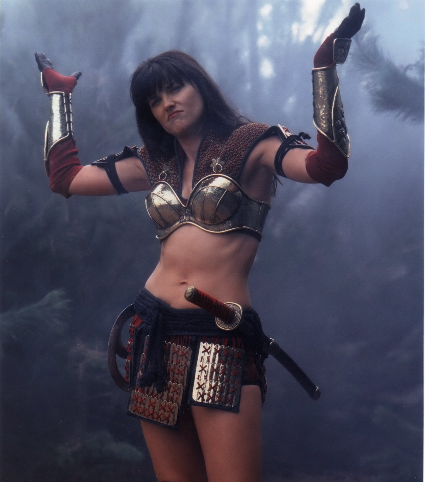 Xena: Warrior Princess (TV Series): Lucy Lawless as the leading character equipped with the Japanese katana and chakram. 1700x1920 HD Background.