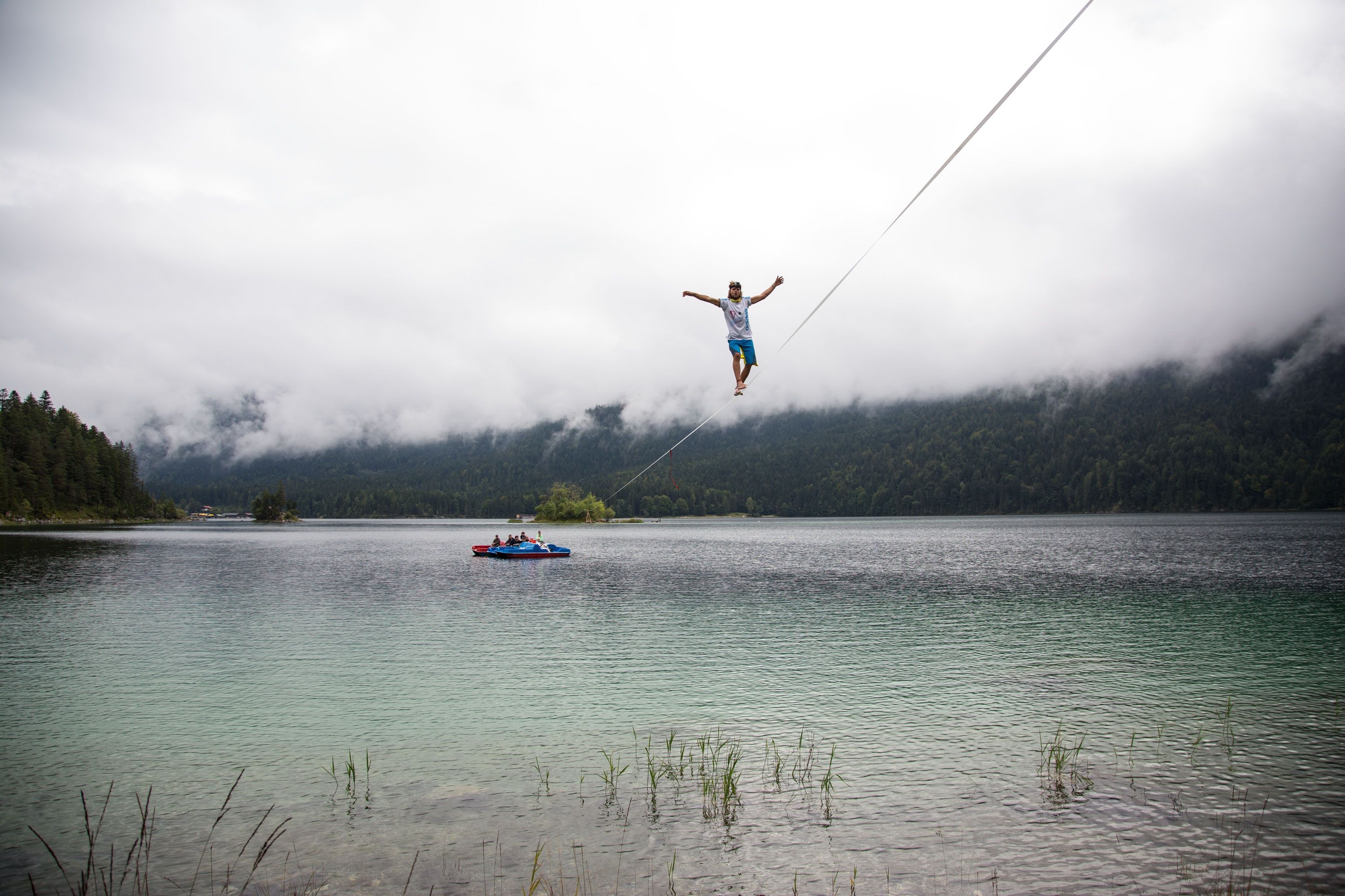Slacklining: Highlining at an elevation above the water, An extreme kind of sports. 3000x2000 HD Background.