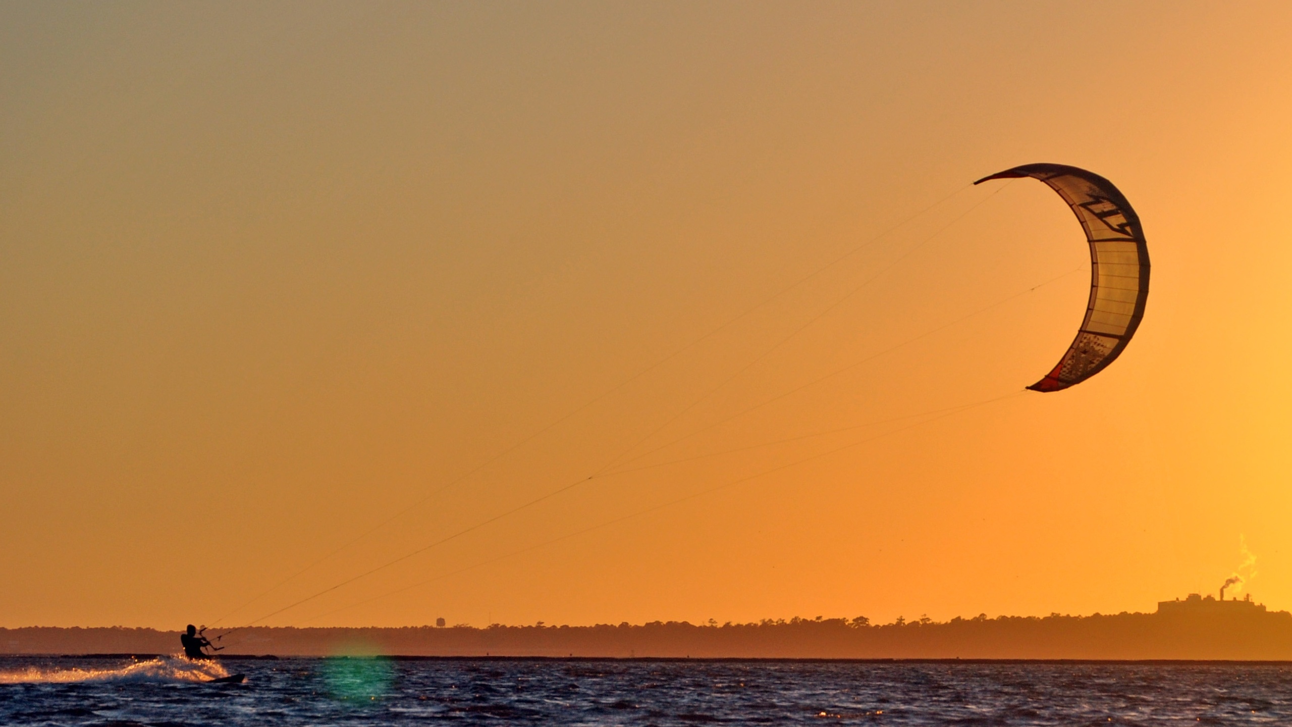 Kiteboarding: Kitesurfing at sunset, Twintip freestyle, Wind speed. 2560x1440 HD Background.