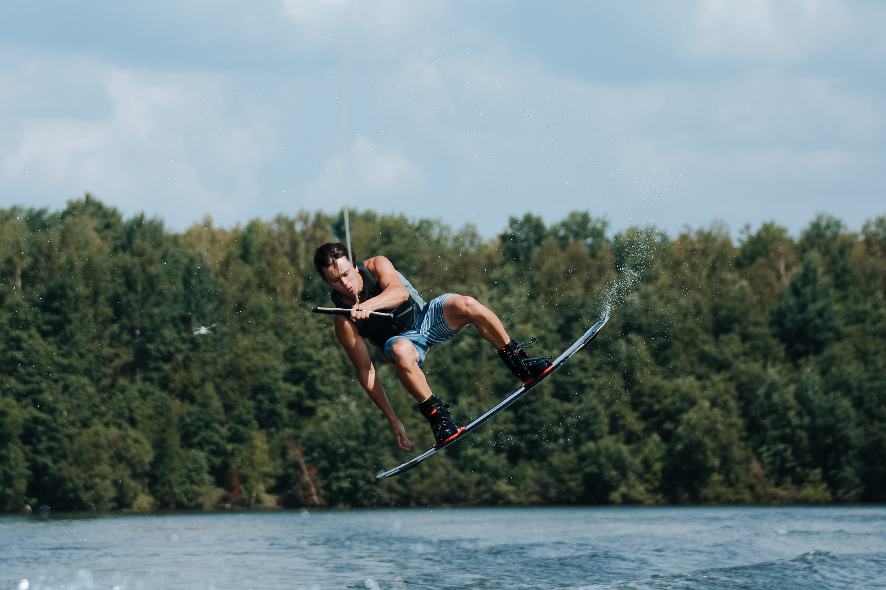 Man wakeboarding, Powerful wakeboarder, Dynamic action shot, Water sports enthusiast, 2950x1970 HD Desktop
