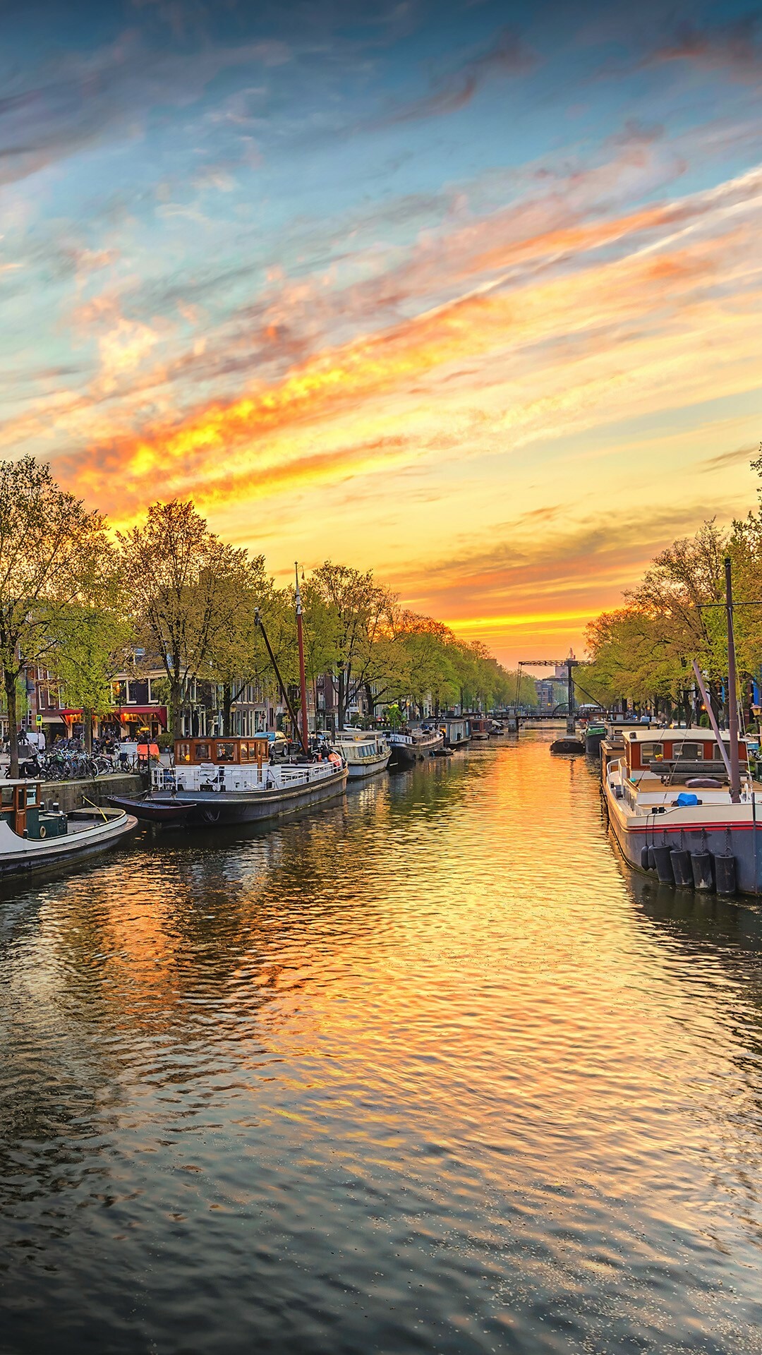 Netherlands: Amsterdam waterfront, Sunset, City skyline, Canal. 1080x1920 Full HD Wallpaper.