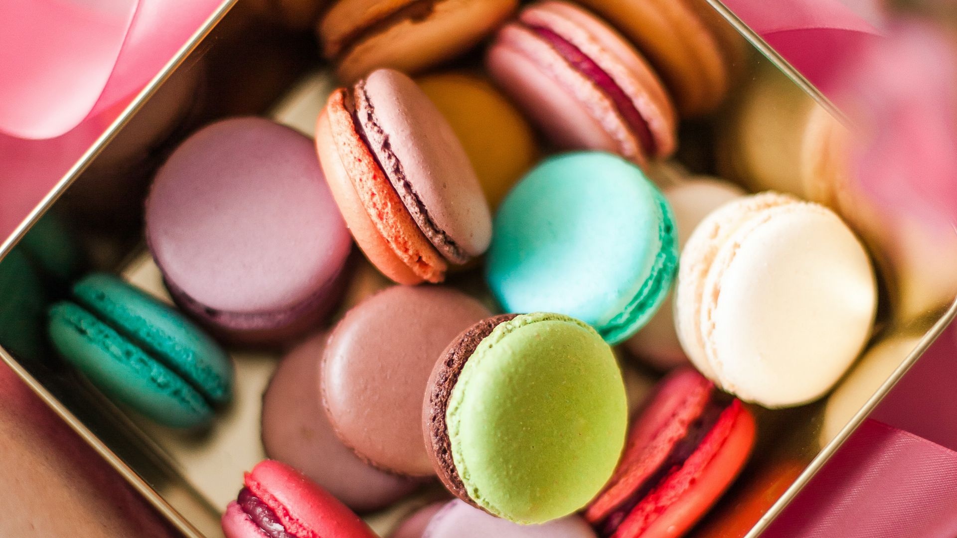 Macaron: French pastry, composed of two shells and a filling in the middle. 1920x1080 Full HD Background.