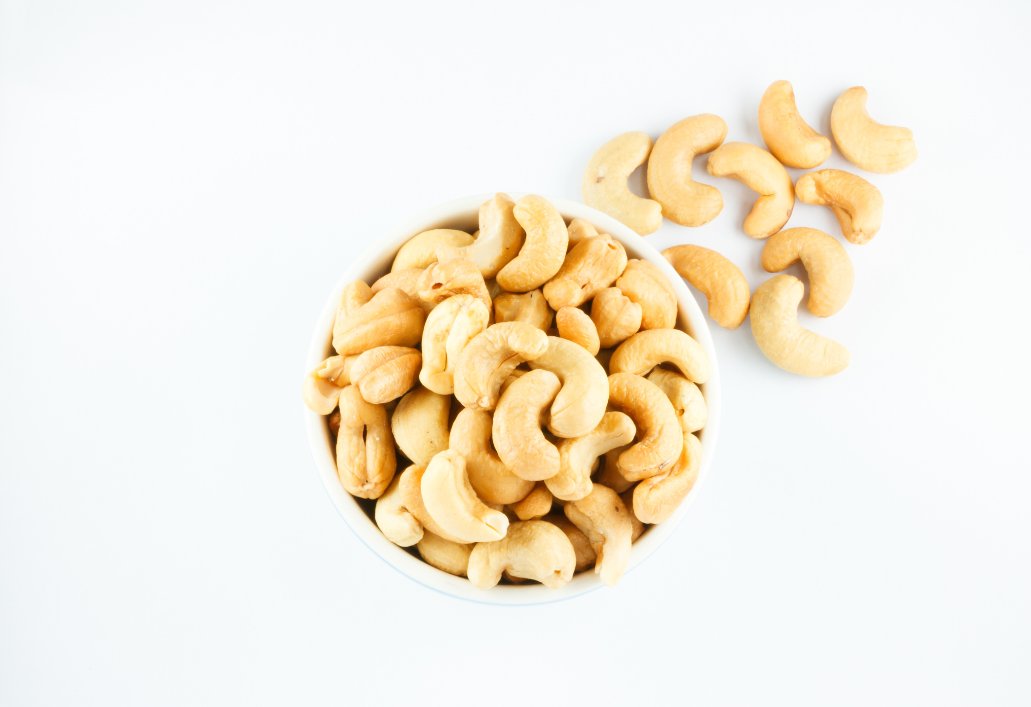 Cashew Nuts: Anacardium occidentale, The seed of a tropical evergreen shrub. 2090x1440 HD Background.