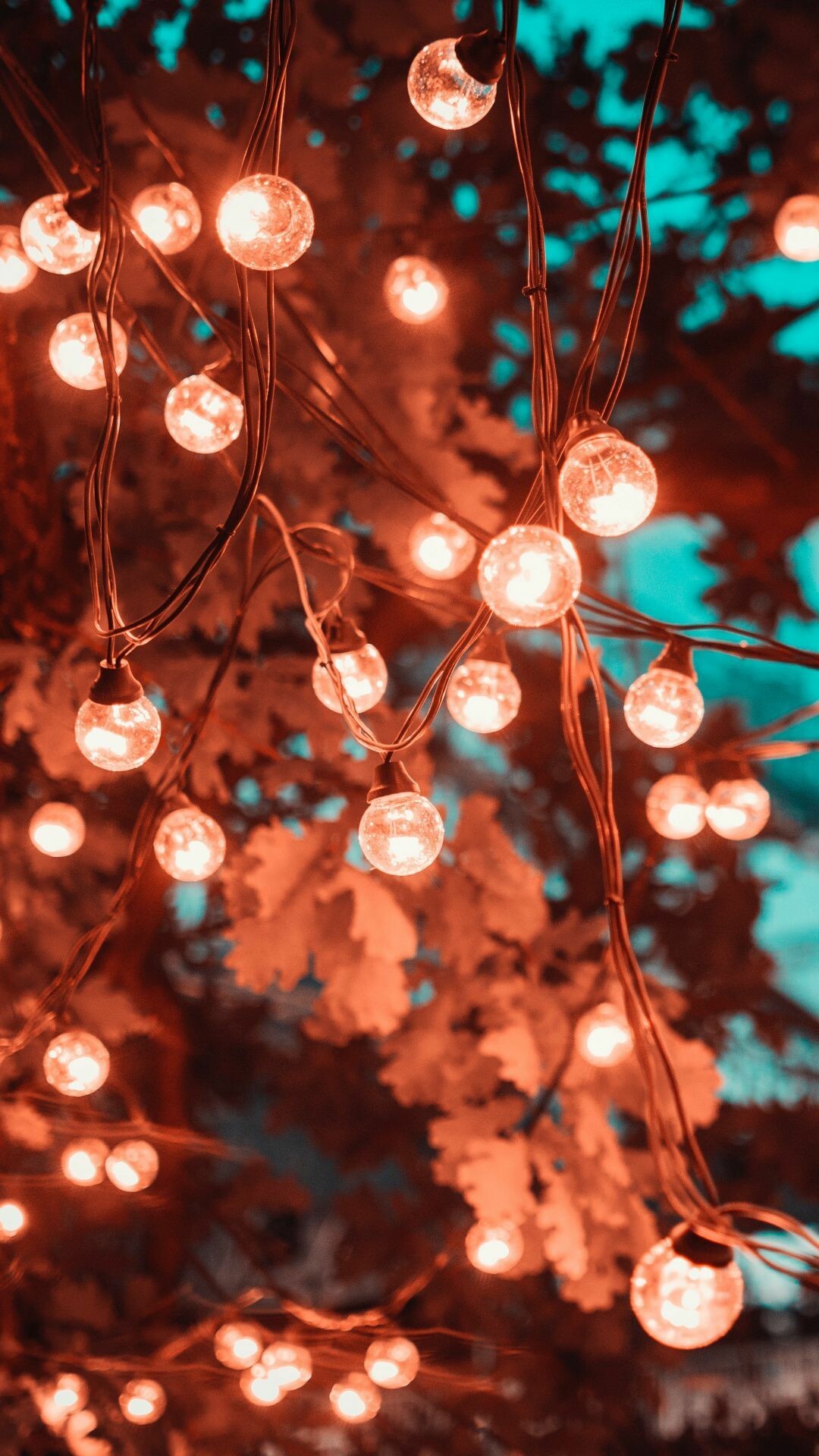Fairy Lights: Christmas trees were lit by candles prior to the 1880s. 1080x1920 Full HD Background.