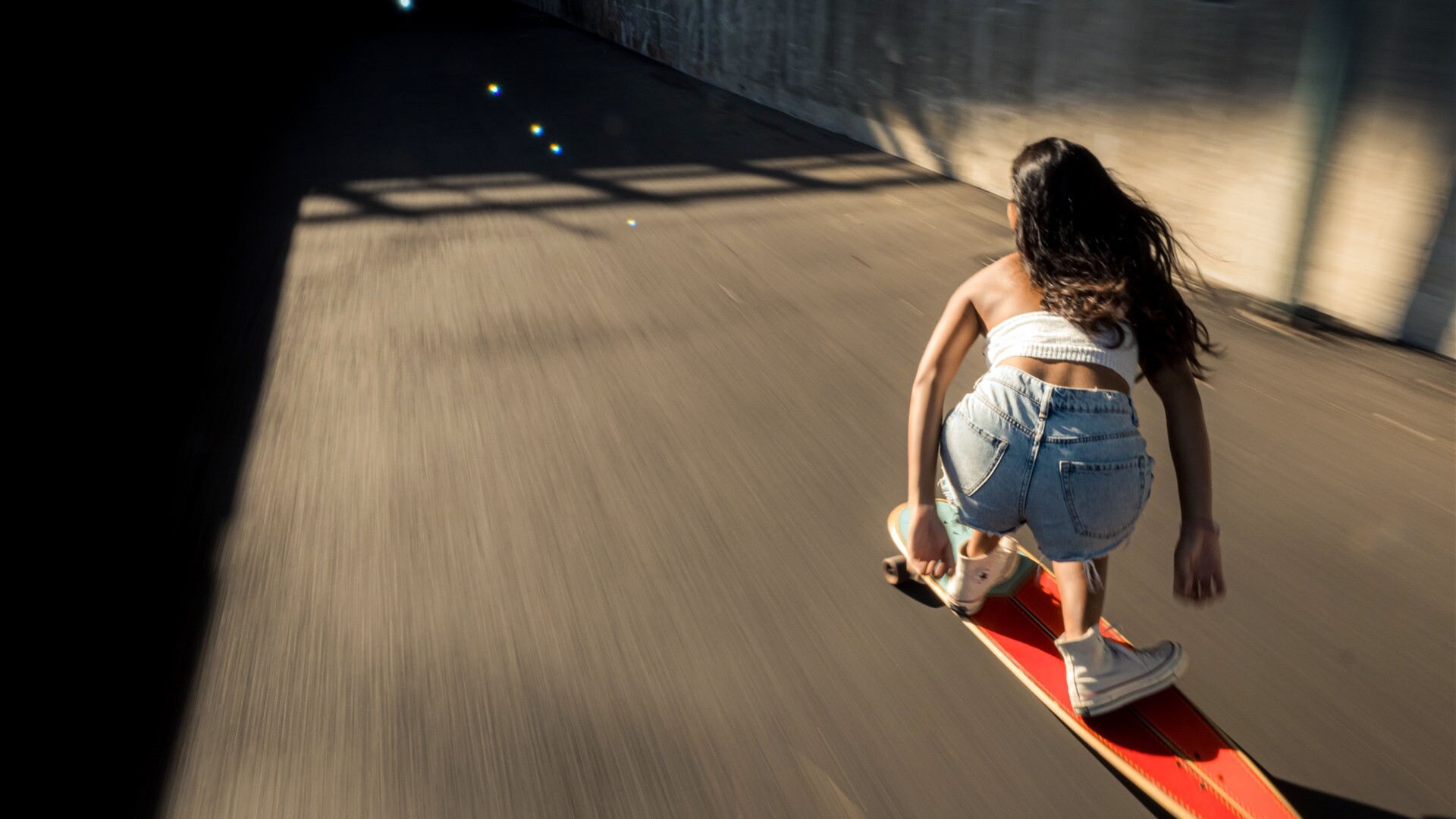 Girl Skateboarding: Extreme downhill skateboarding at high speeds, A method of transportation, Long-distance commuting. 1920x1080 Full HD Background.