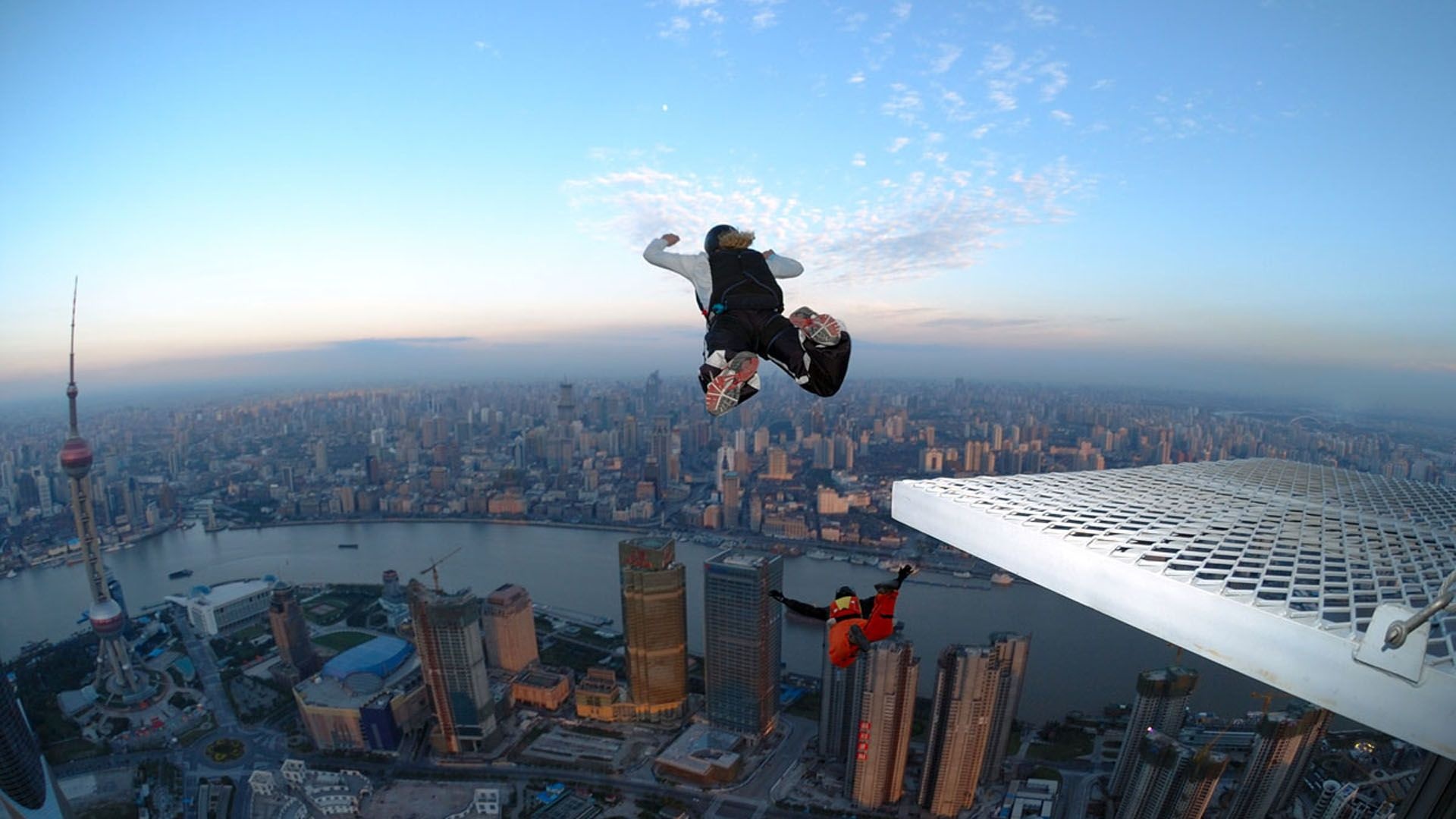 BASE Jumping: Jumping from a skyscraper, Air sport in the city, Extreme activity. 1920x1080 Full HD Background.