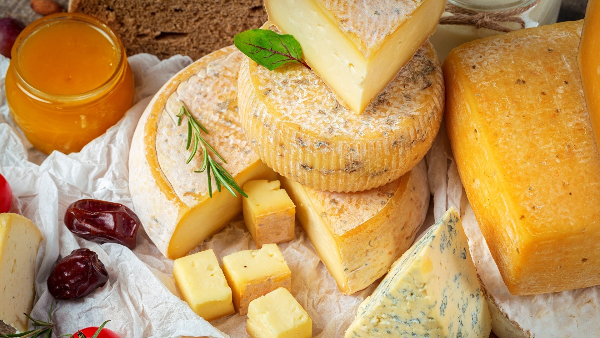 Cheese: Coated in wax or natural rinds to protect during aging and storage. 1920x1080 Full HD Background.