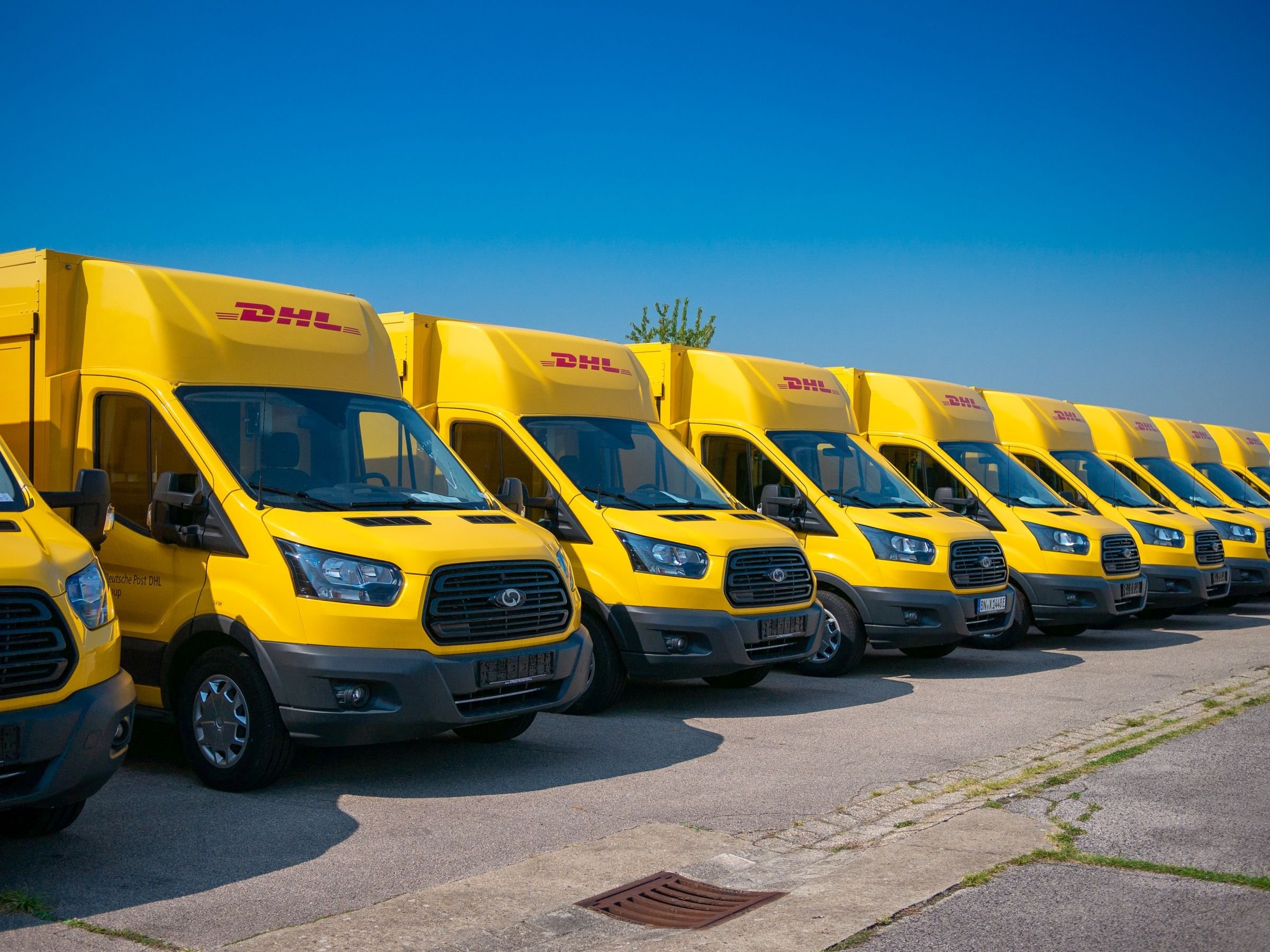 DHL: One of the leading providers of road freight services in Europe, Sufficient transport capacities. 2400x1800 HD Background.