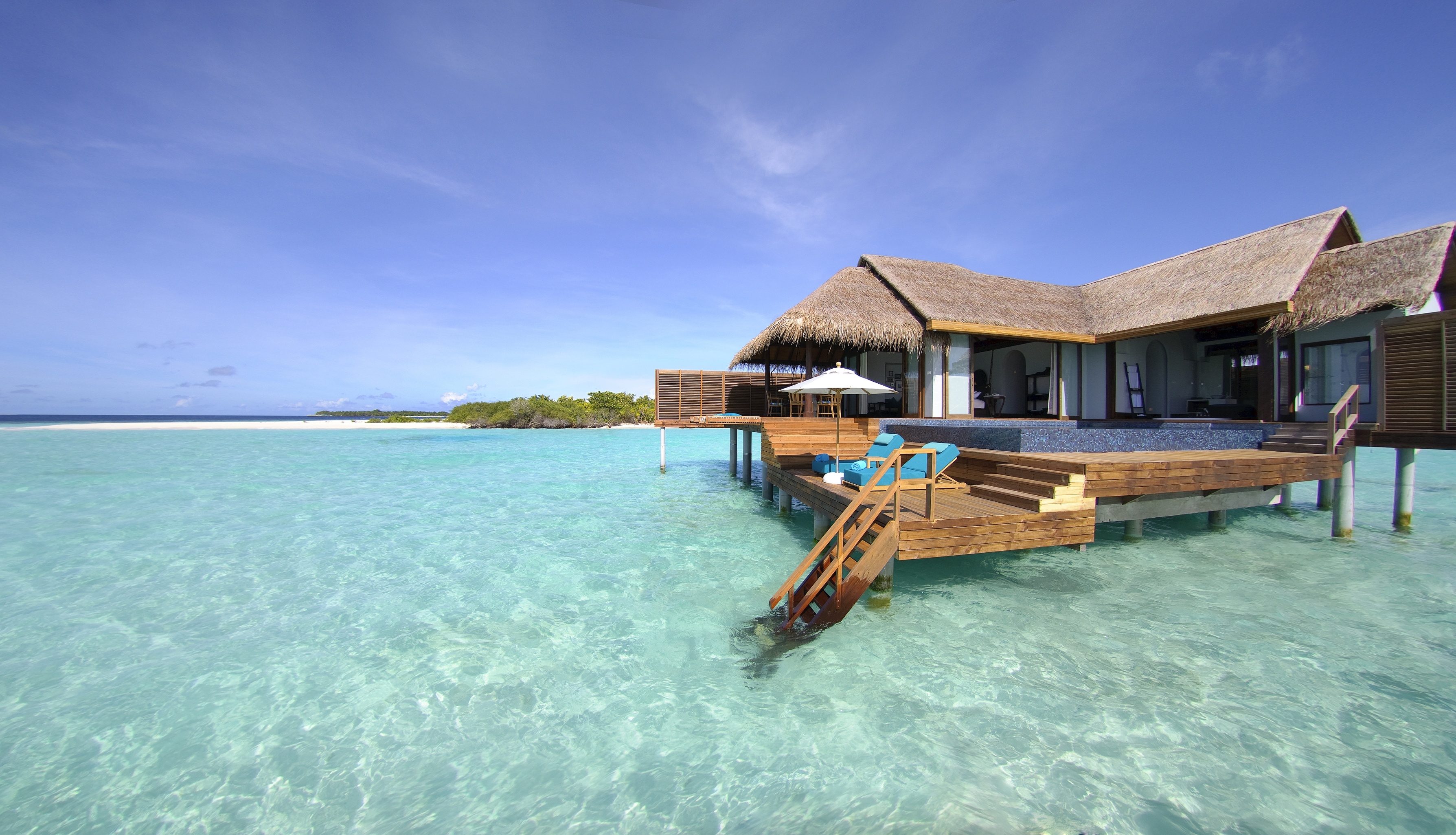 Bungalow: A vacation overwater house at the coast of the Indian Ocean, Traditional architecture. 3580x2050 HD Background.