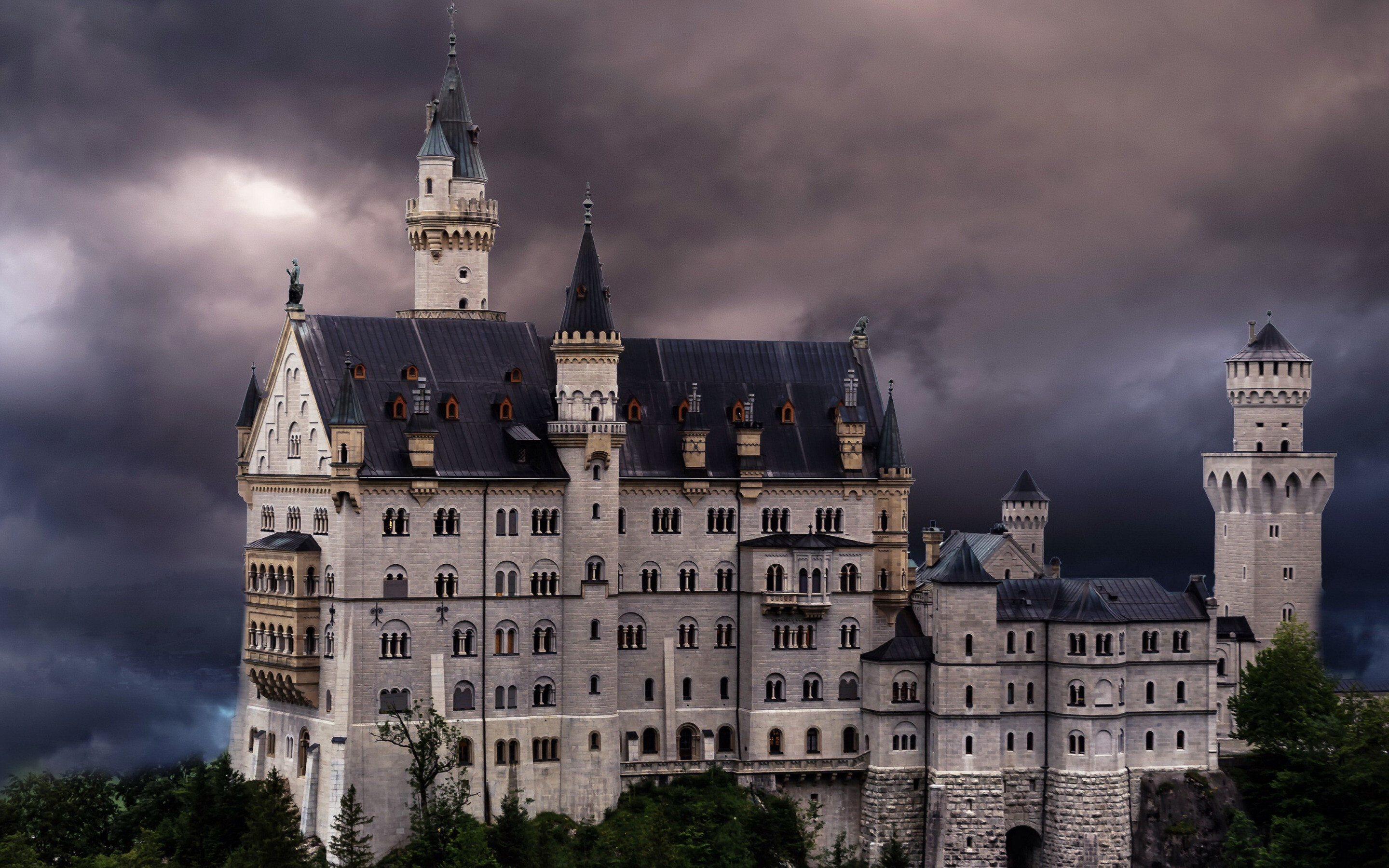 Neuschwanstein Castle: Neo-gothic palace, commenced by the Bavarian King Ludwig II in 1869 and never completed. 2880x1800 HD Background.
