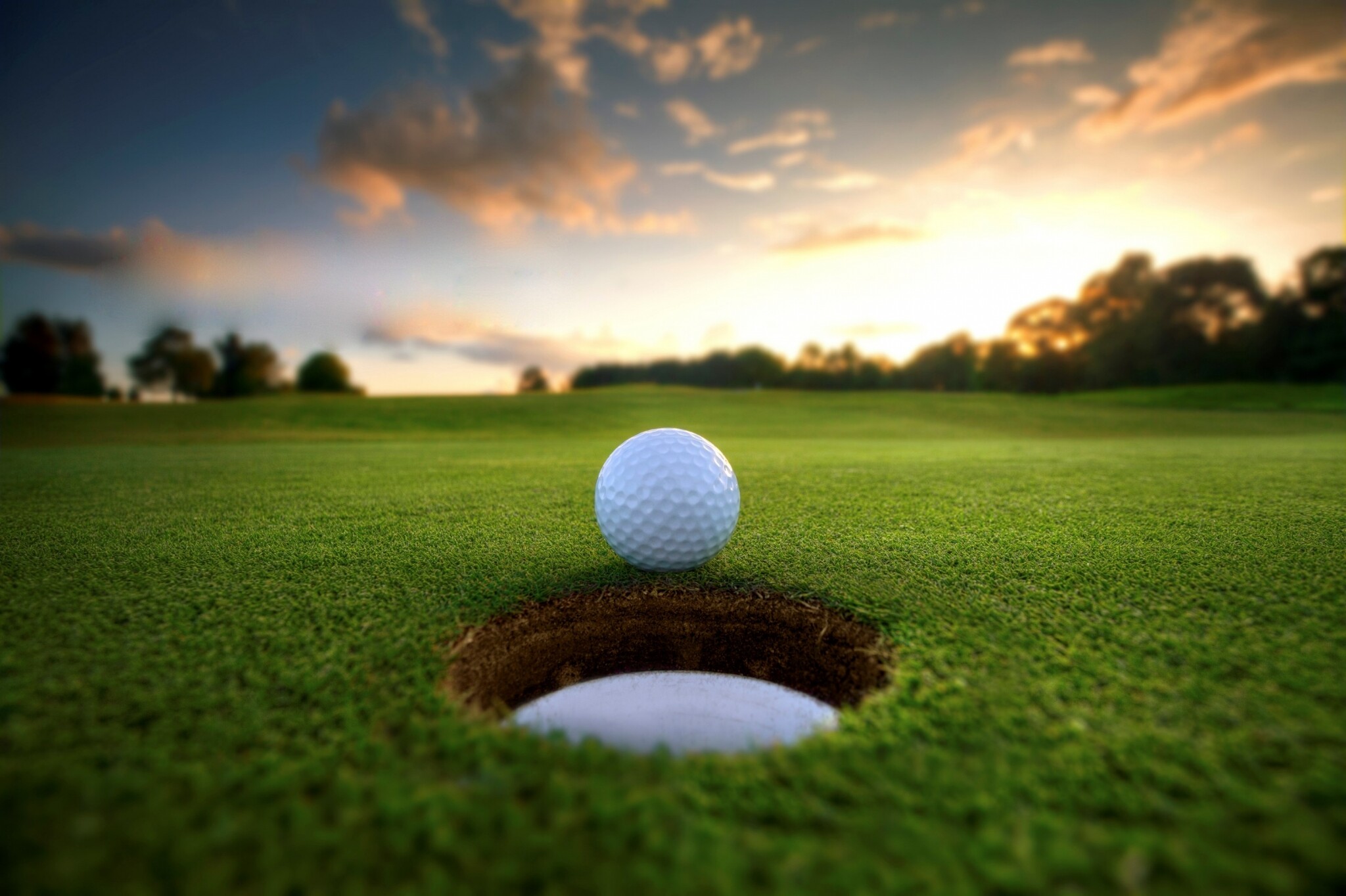 Golf: Hitting a small ball into a series of holes on a course, A club-and-ball sport. 2050x1370 HD Background.