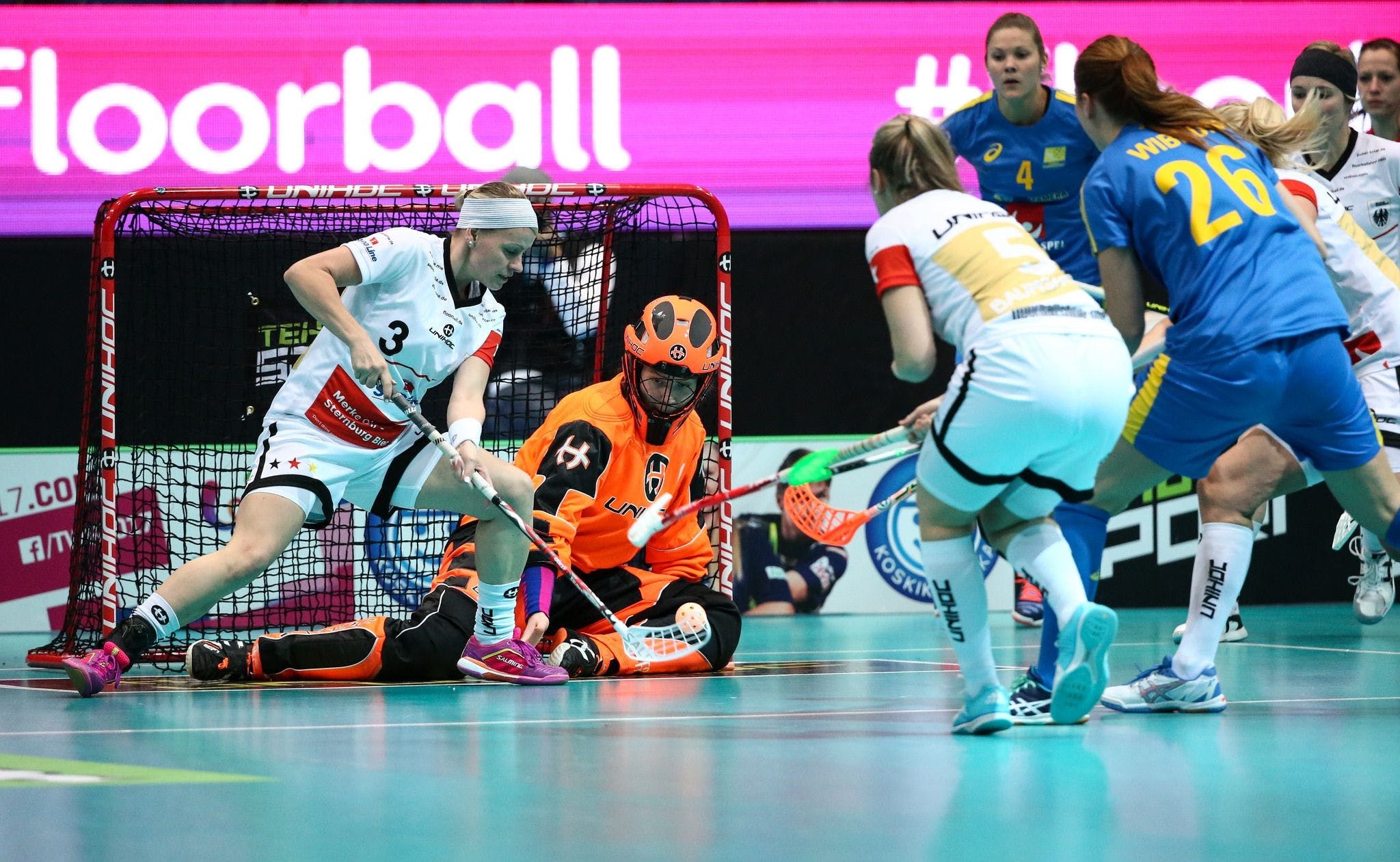 Floorball: A type of floor hockey with five players and a goalkeeper on each team, A mixed-sex sports discipline. 2050x1270 HD Background.
