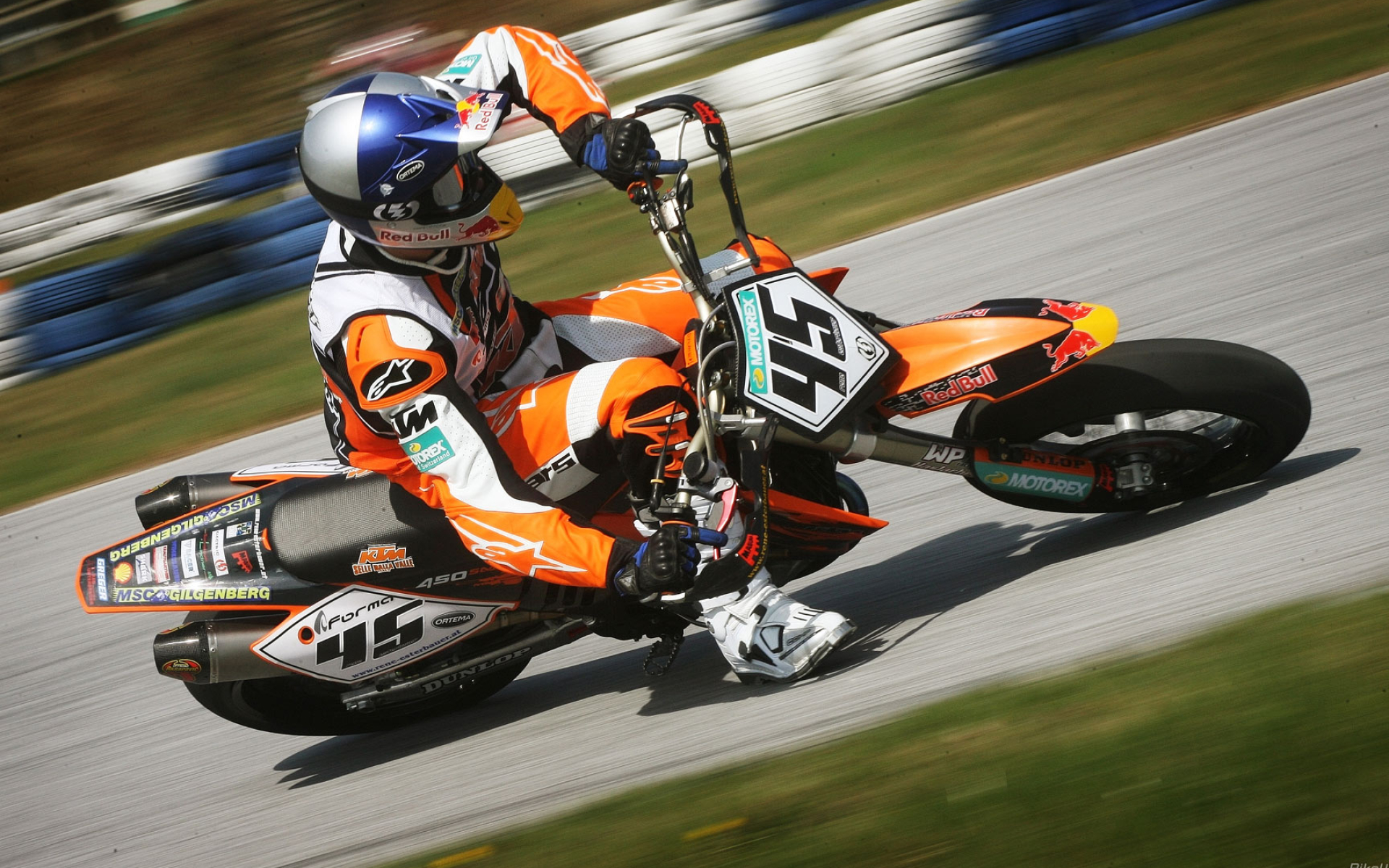 Supermoto: Cornering in a tarmac section, Motorcycle racing held on race tracks, KTM. 1920x1200 HD Background.