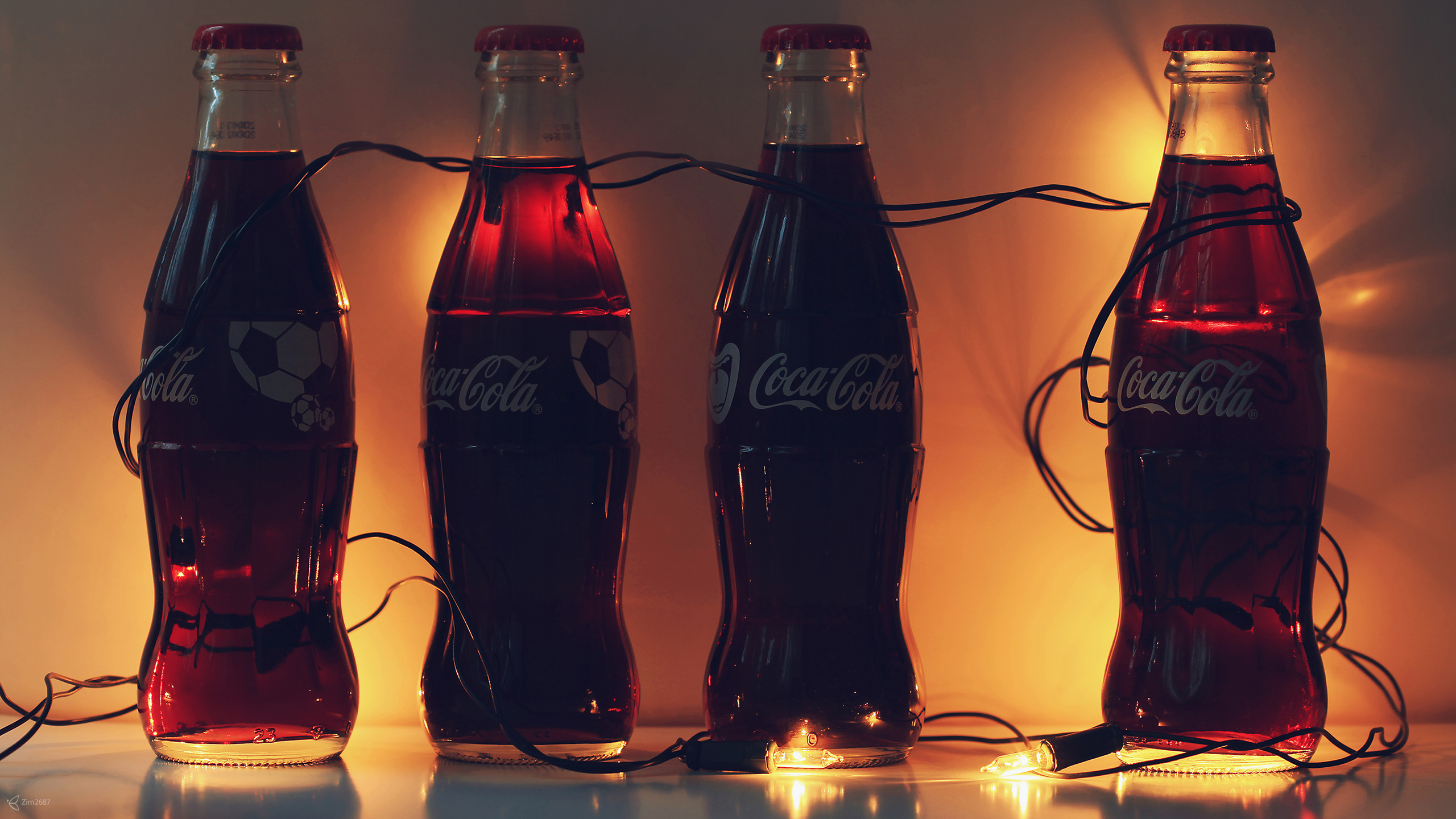 Coca Cola bottles, Sparkling cola lights, Retro-inspired wallpaper, Refreshing drink, 2560x1440 HD Desktop
