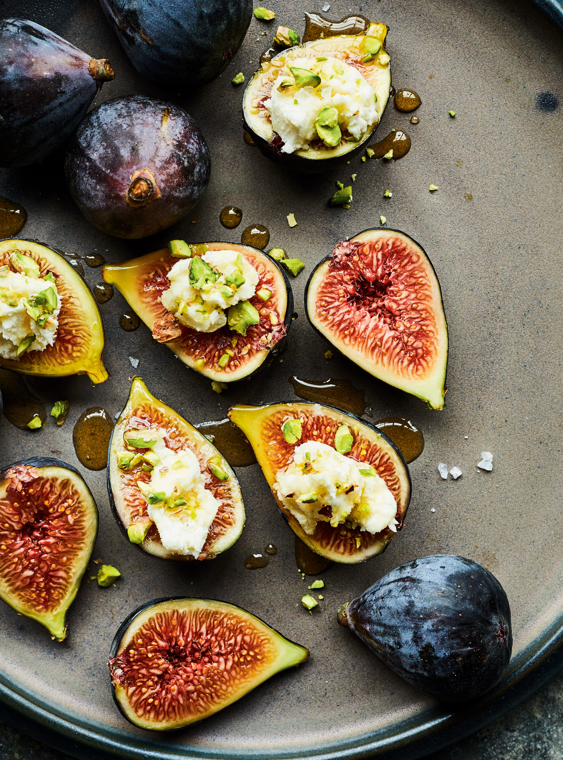 Fig: Figs and goat cheese bites with pistachios and honey. 1920x2600 HD Background.