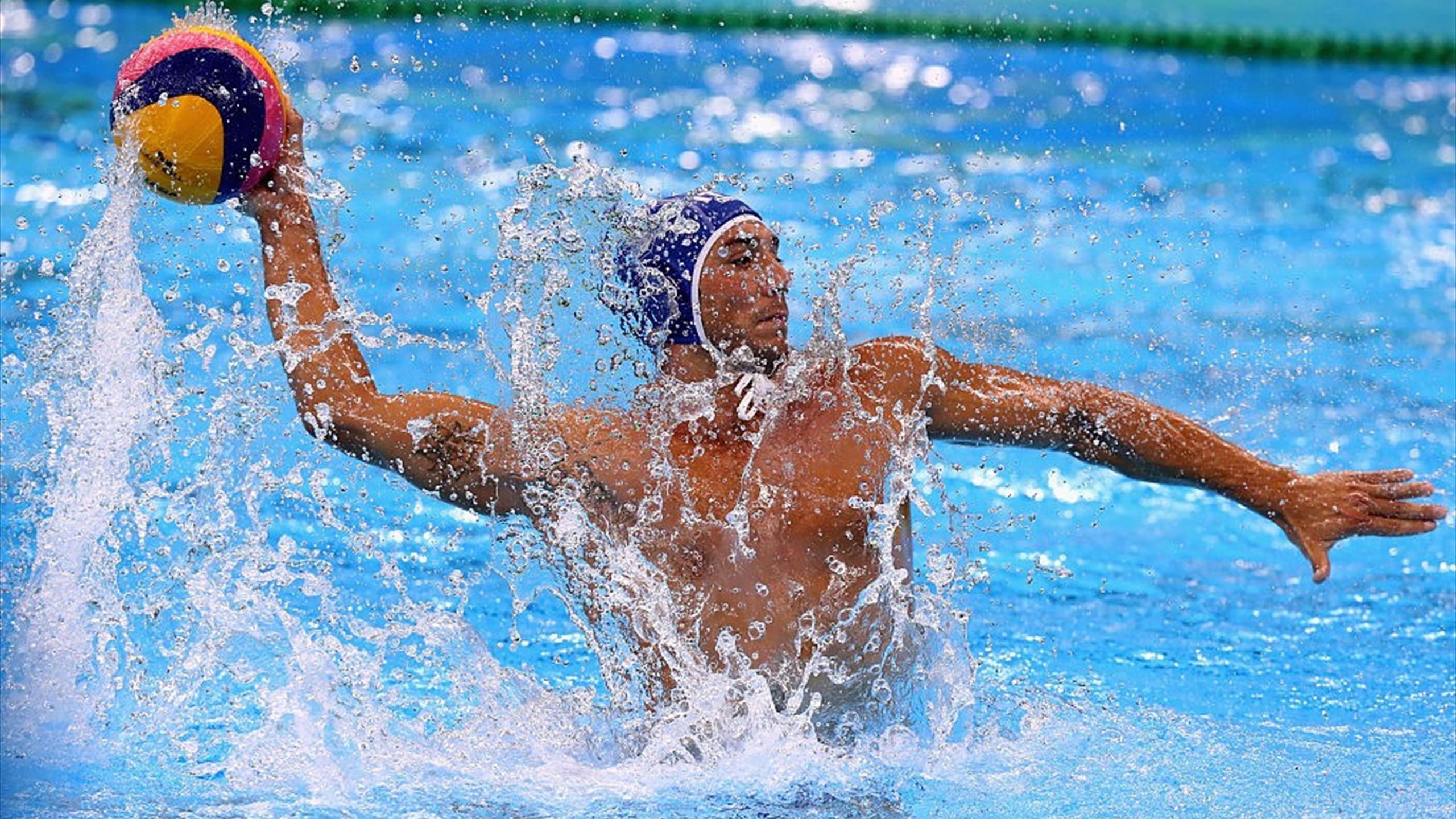 Water Polo: An official Men's Olympic sport since the 1900 Summer Olympic Games. 2560x1440 HD Background.