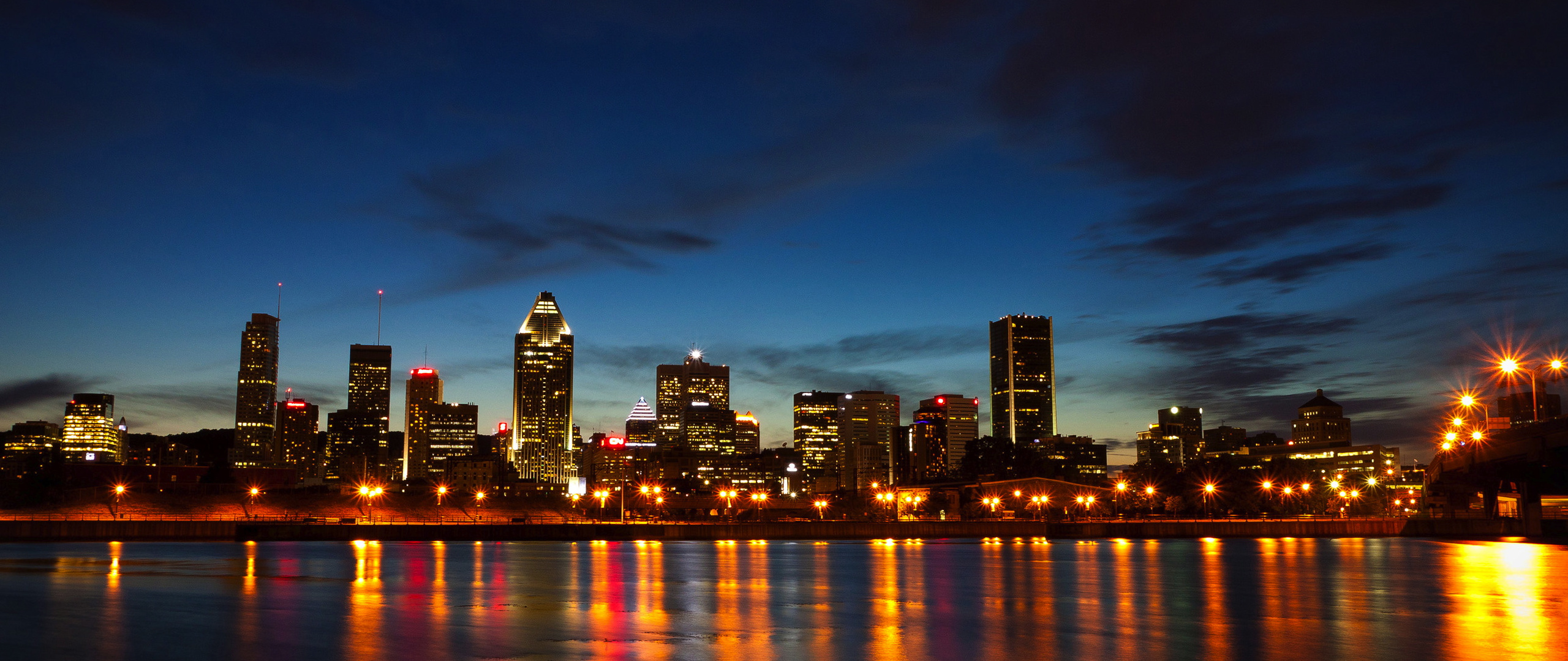 St. Lawrence River, Montreal at dusk, Cityscape from the water, Captivating skyline, 2560x1080 Dual Screen Desktop