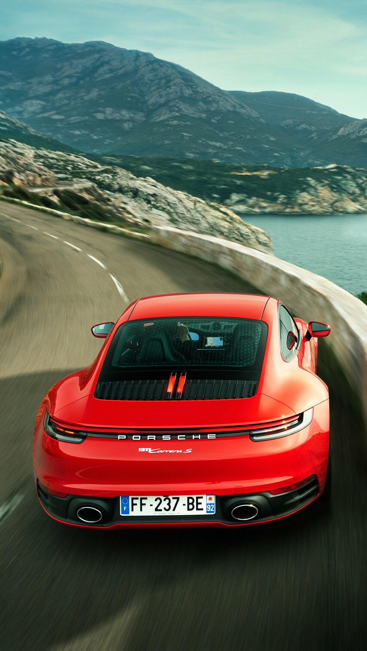 Porsche 911: Two versions of the 997 were introduced: the rear-wheel-drive Carrera and Carrera S. 1220x2160 HD Background.