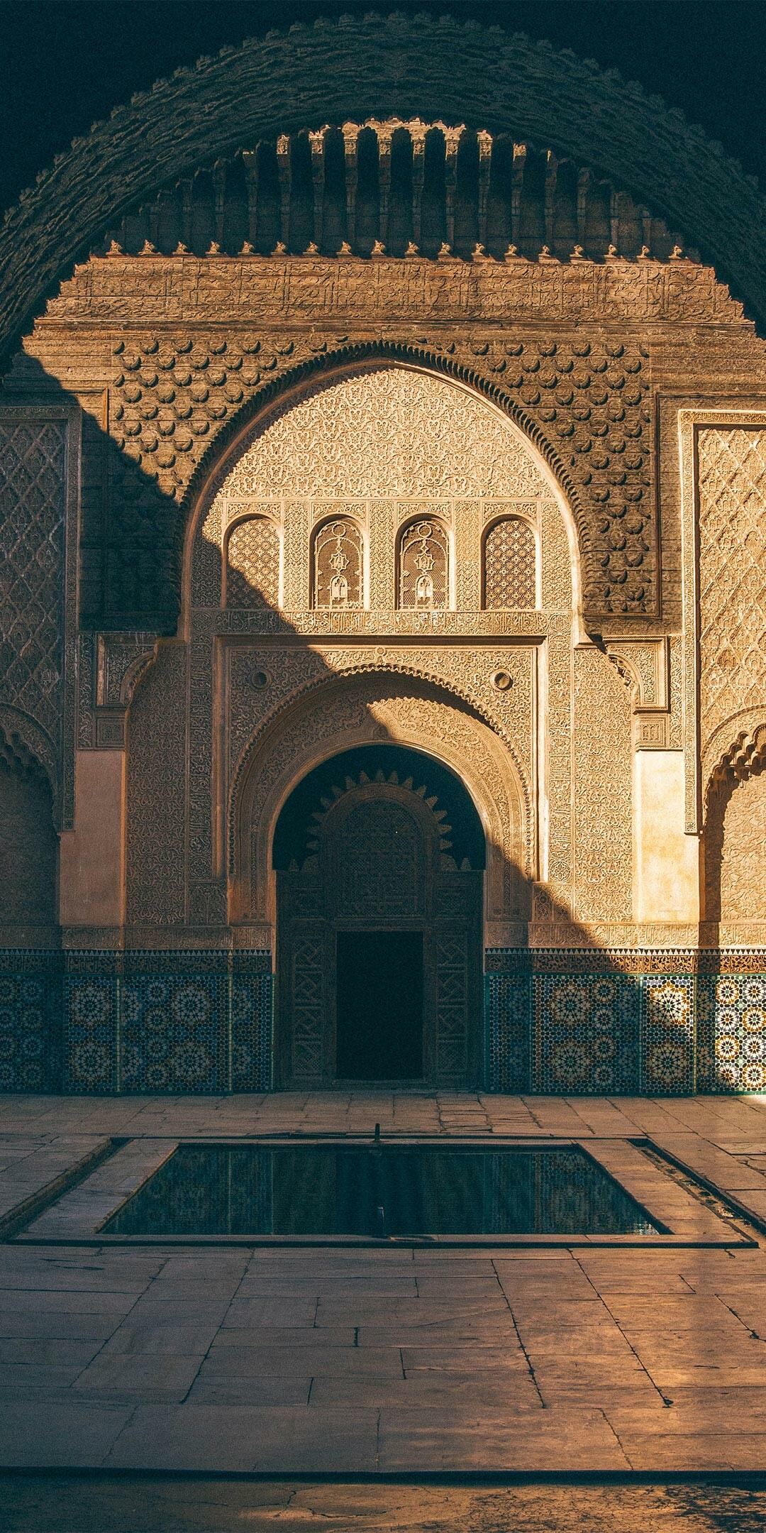 Morocco: Ben Youssef Madrasa, Islamic college, Marrakesh, Architecture. 1080x2160 HD Wallpaper.