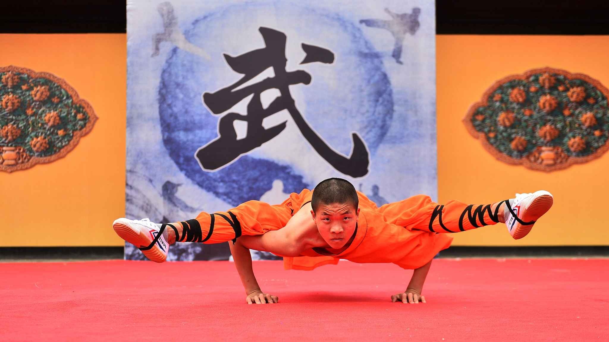 Shaolin Kung Fu: Ba Duan Jin, A traditional Chinese health exercise performed by Buddhist monks, The Qatar National Theater, Qatar, 30th Anniversary. 2050x1160 HD Background.