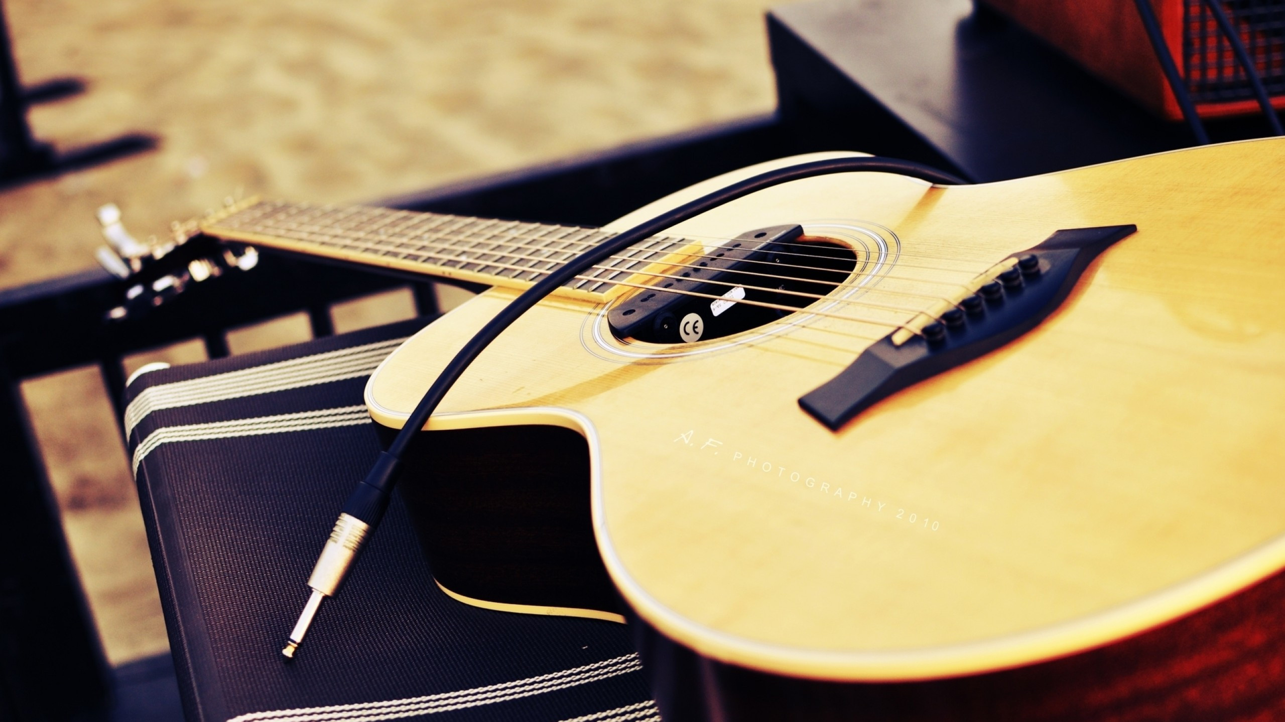 Musical Instruments: Acoustic guitar, The string family of instruments, Plucking a string. 2560x1440 HD Wallpaper.