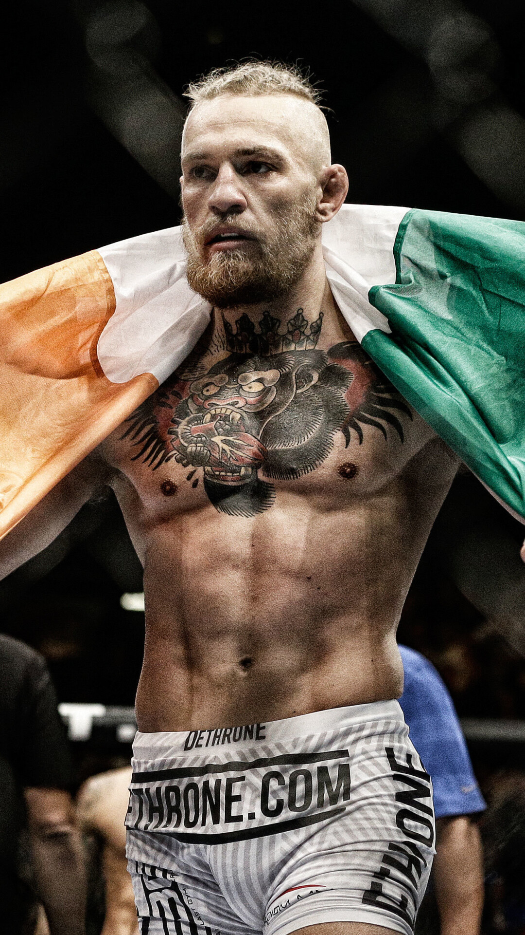 Conor McGregor: The first fighter in UFC history to hold titles in two divisions at the same time. 1080x1920 Full HD Background.