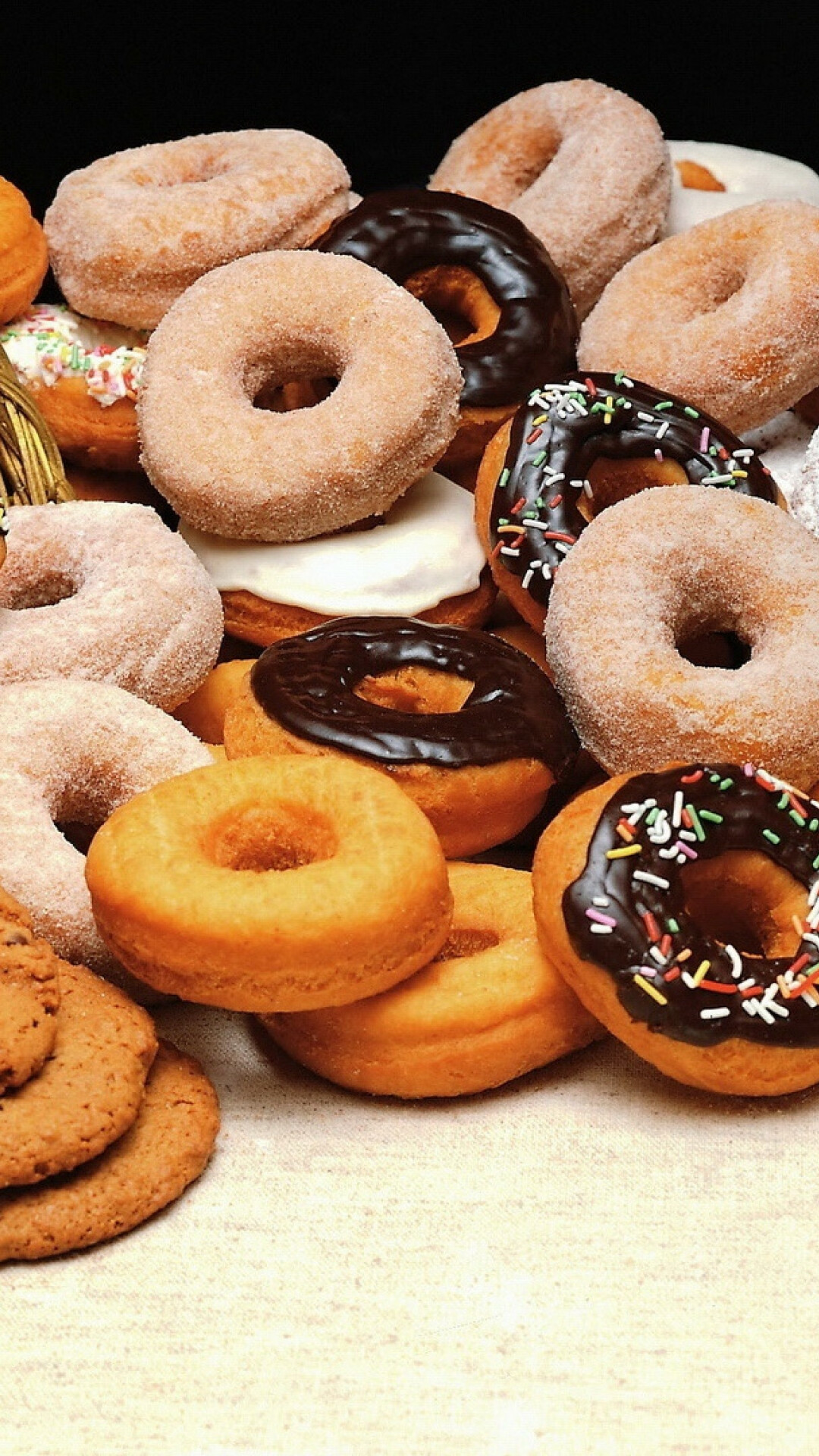 Sweets: Doughnuts, Ring-shaped snack food popular in many countries. 1080x1920 Full HD Background.