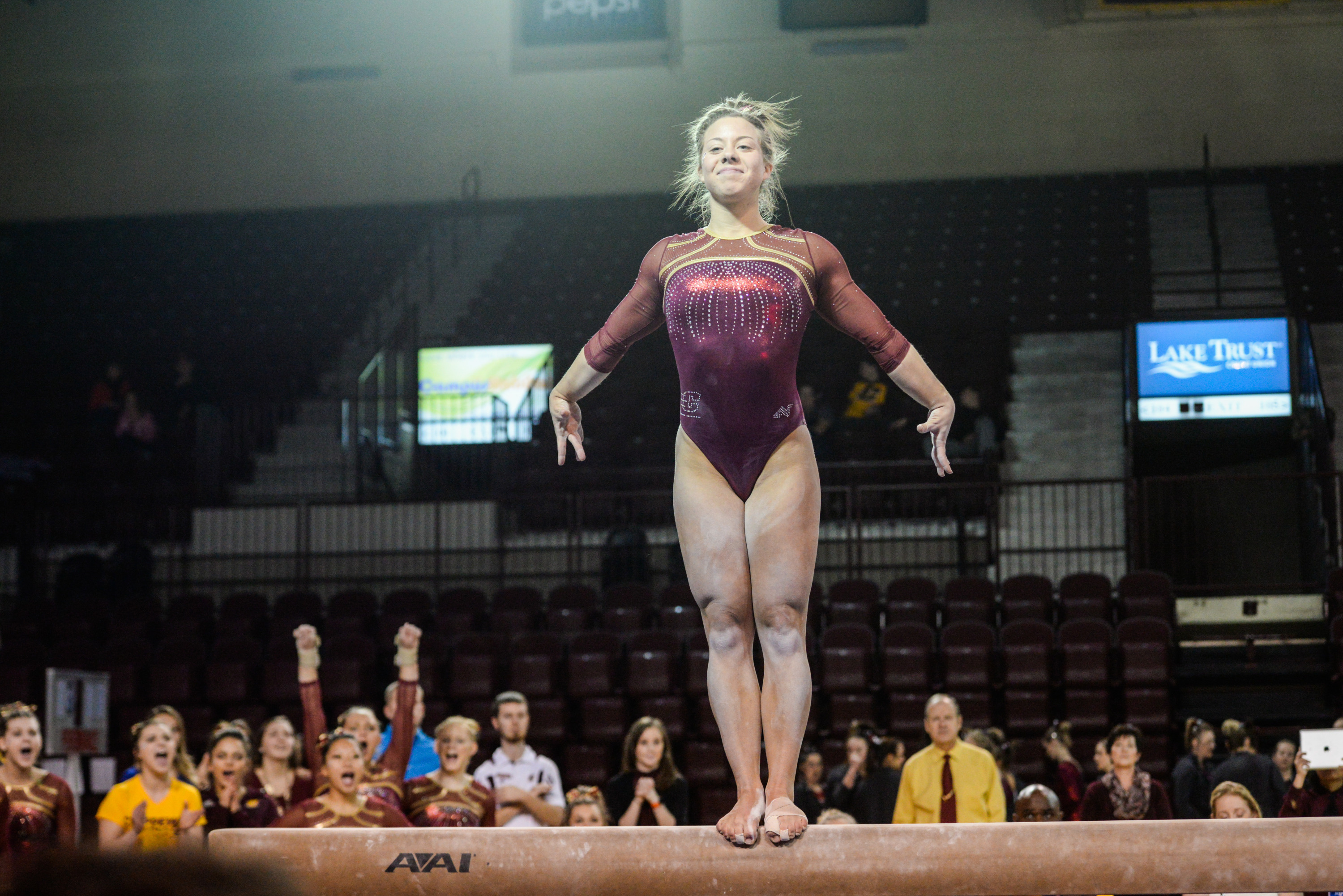 Balance Beam: The Central Michigan gymnastics team, Mid-American Conference dual event. 3000x2010 HD Background.
