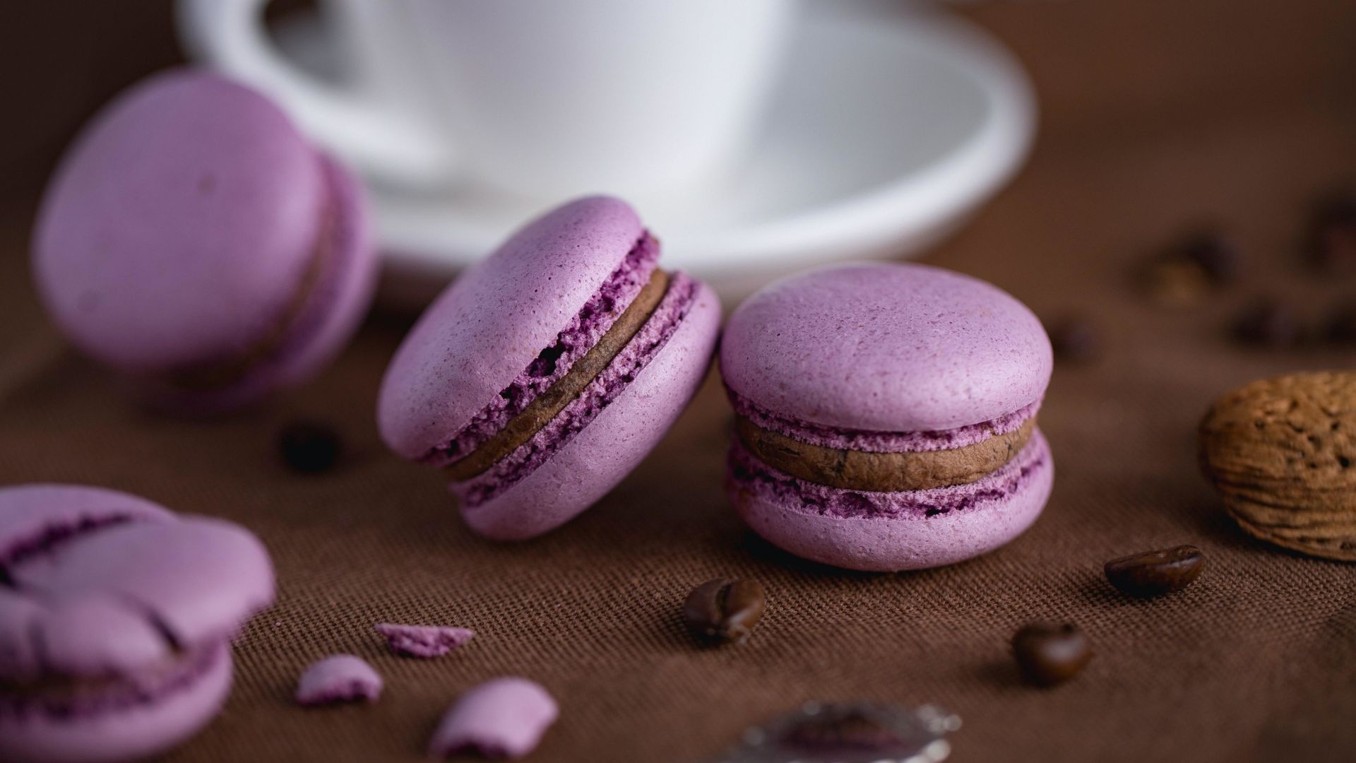 Macaron: Little sweet sandwiches made of meringue, almond flour and buttercream filling. 1920x1080 Full HD Background.