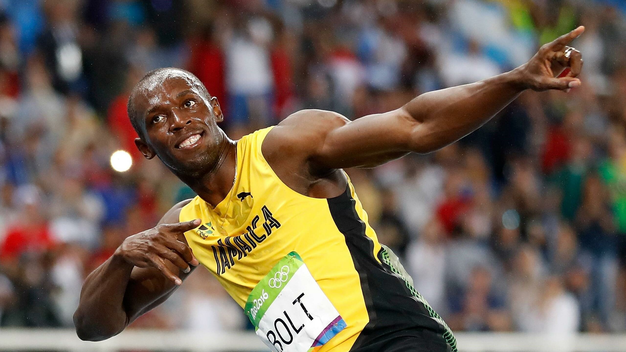 Usain Bolt: The first athlete to win four World Championship titles in the 200 m. 2560x1440 HD Background.