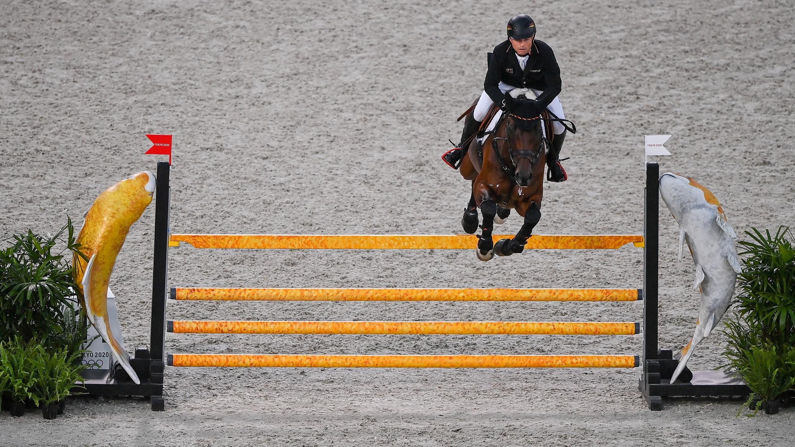 Eventing: Michael Jung, A three-time Olympic gold medallist, The second rider in history to win the Grand Slam of Eventing. 2560x1440 HD Background.