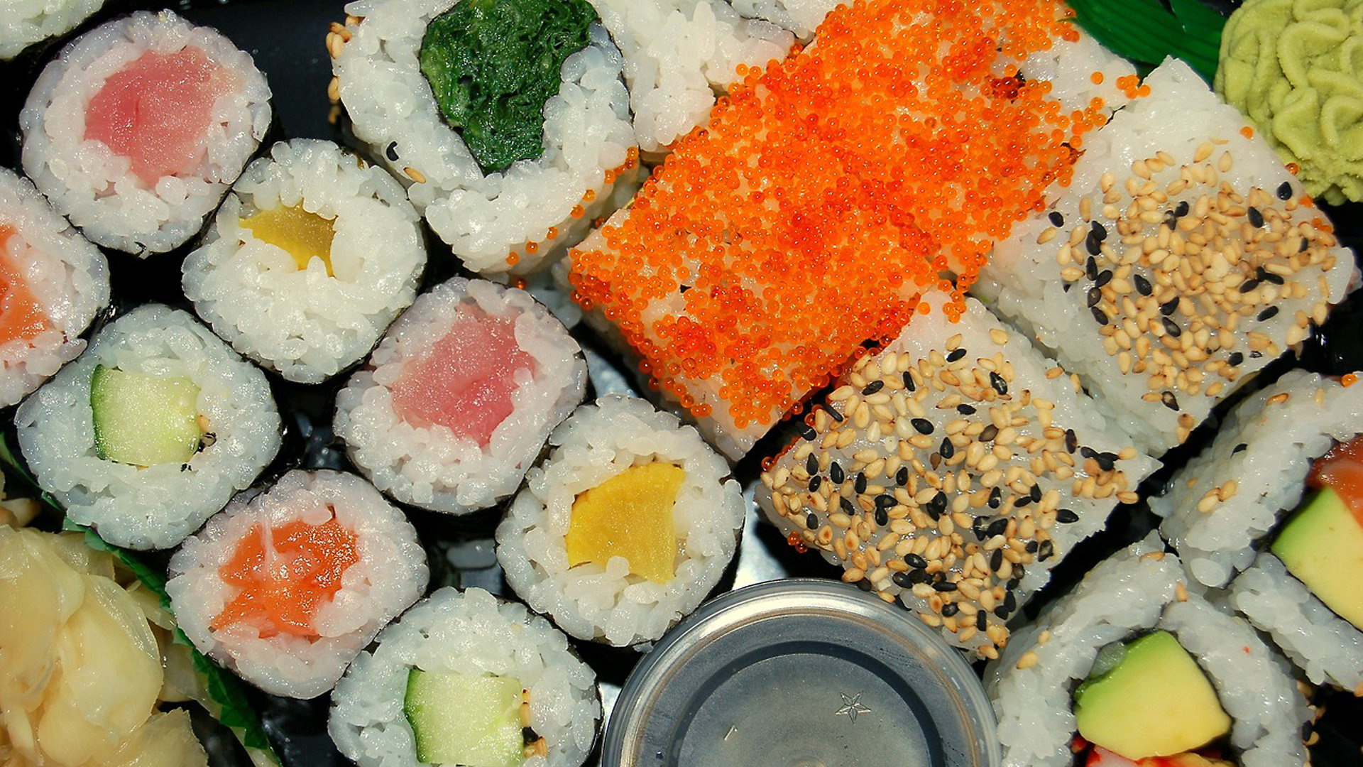 Sushi: Maki, Rolled in a sheet of nori, Tobiko. 1920x1080 Full HD Background.