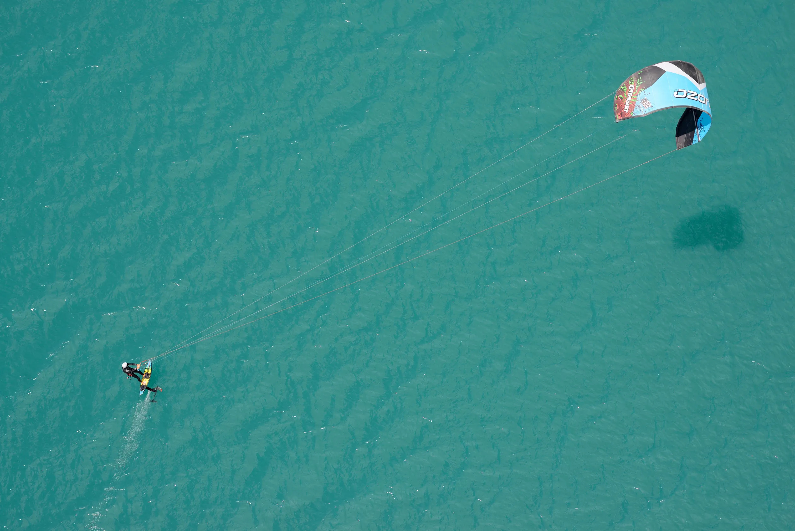 Kiteboarding: Wind power, A large power kite, Pulling a rider across the sea. 2560x1710 HD Background.