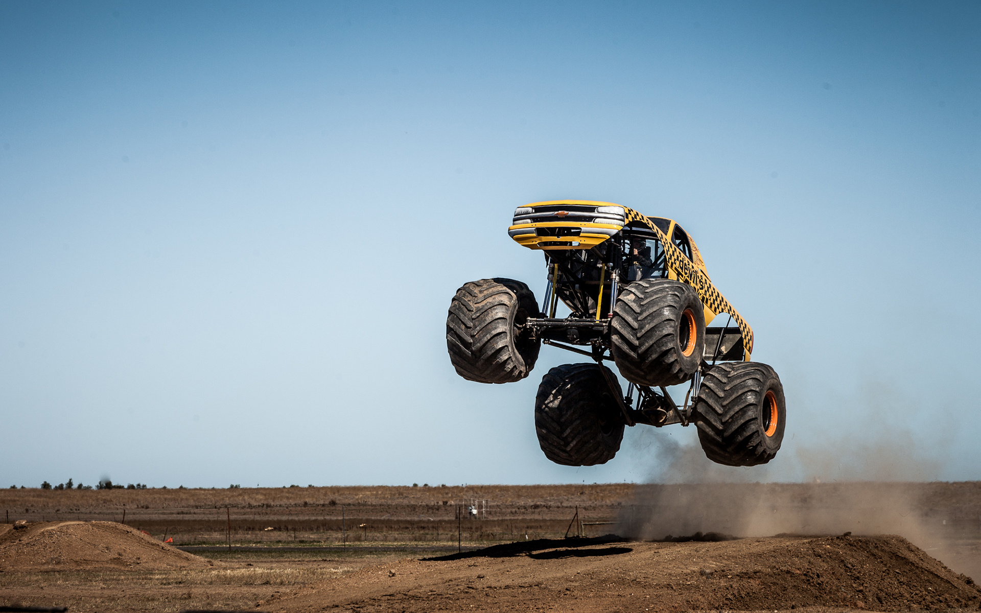Monster Truck: Record-breaking, Jumping up to 30 feet in the air, A freestyle stunt driving competition. 1920x1200 HD Background.
