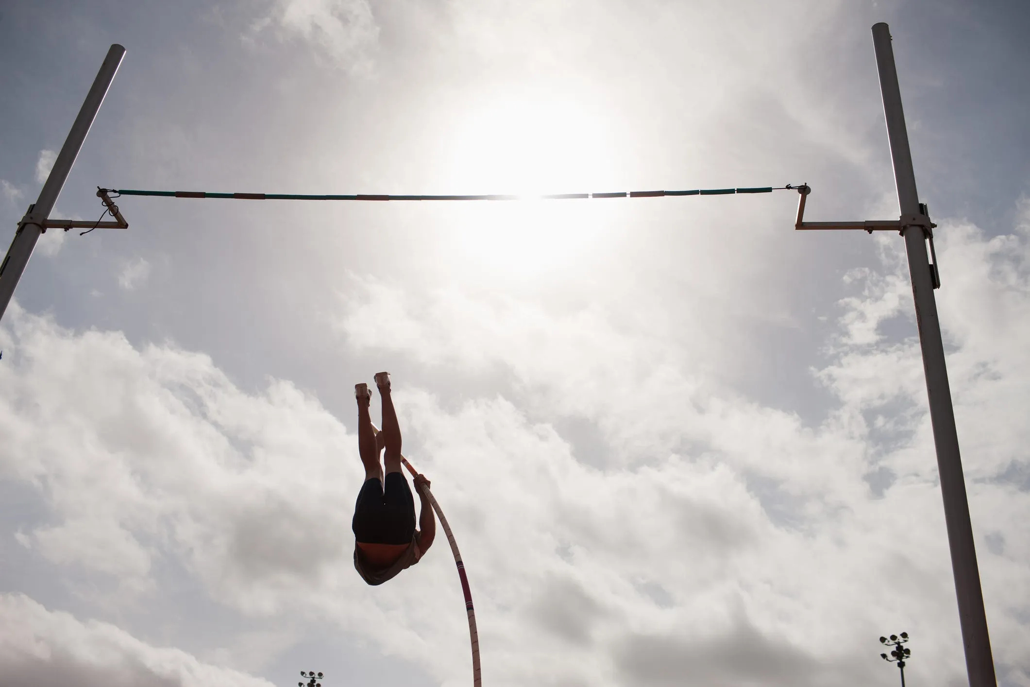 Pole Vaulting: An athletic event in which competitors jump as high as possible using a long and flexible stick. 2130x1420 HD Background.