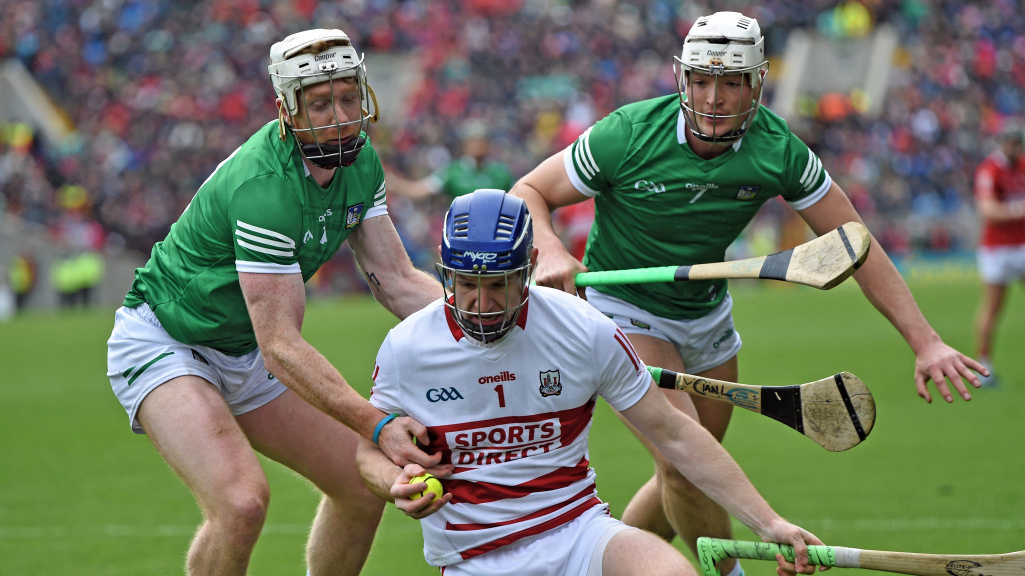 Hurling: Cork goalkeeper Patrick Collins under pressure from Limerick duo Cian Lynch and Kyle Hayes. 2050x1160 HD Wallpaper.