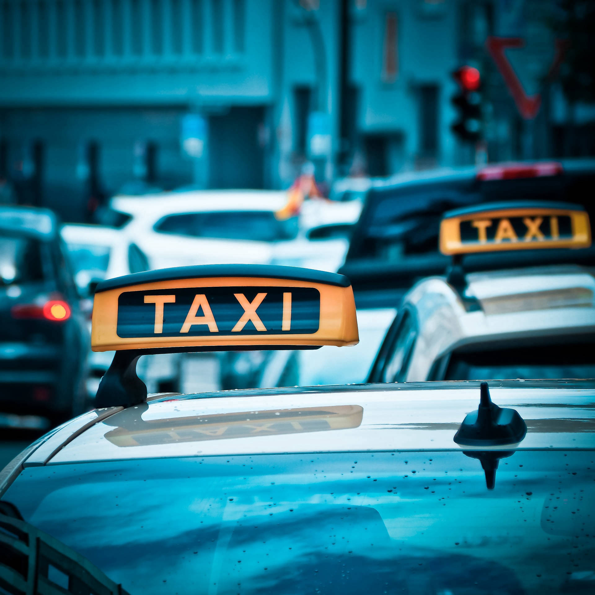 Taxi: A hired vehicle, Provides either street hail or pre-arranged taxicab service. 1920x1920 HD Background.