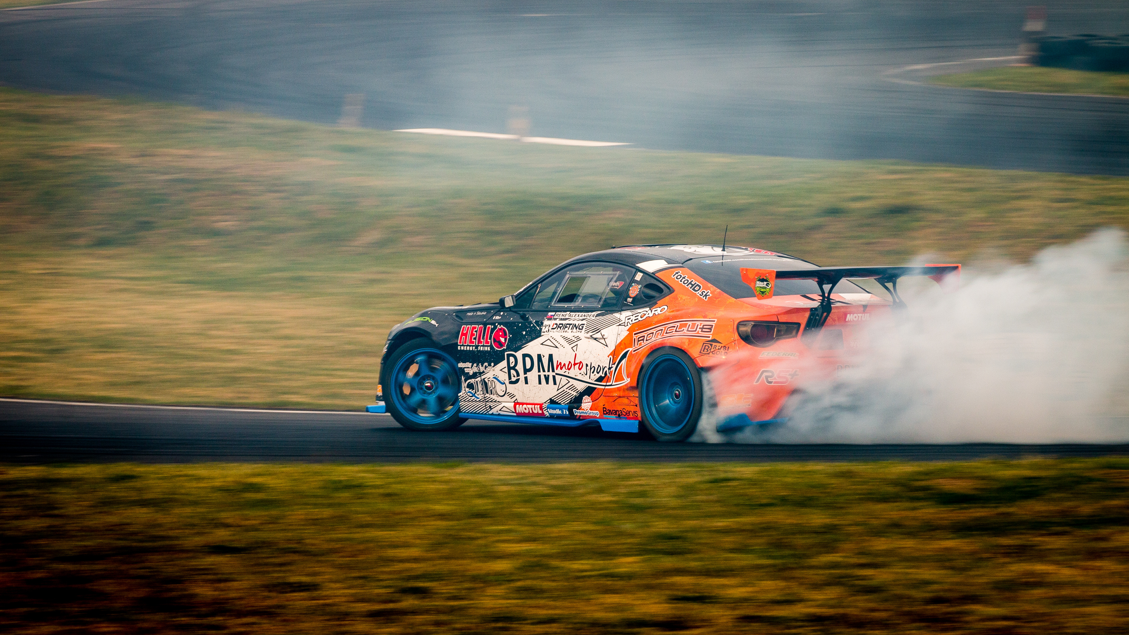 Drifting: Toyota Supra at the turn on a racing track, Smoking wheels. 3840x2160 4K Wallpaper.