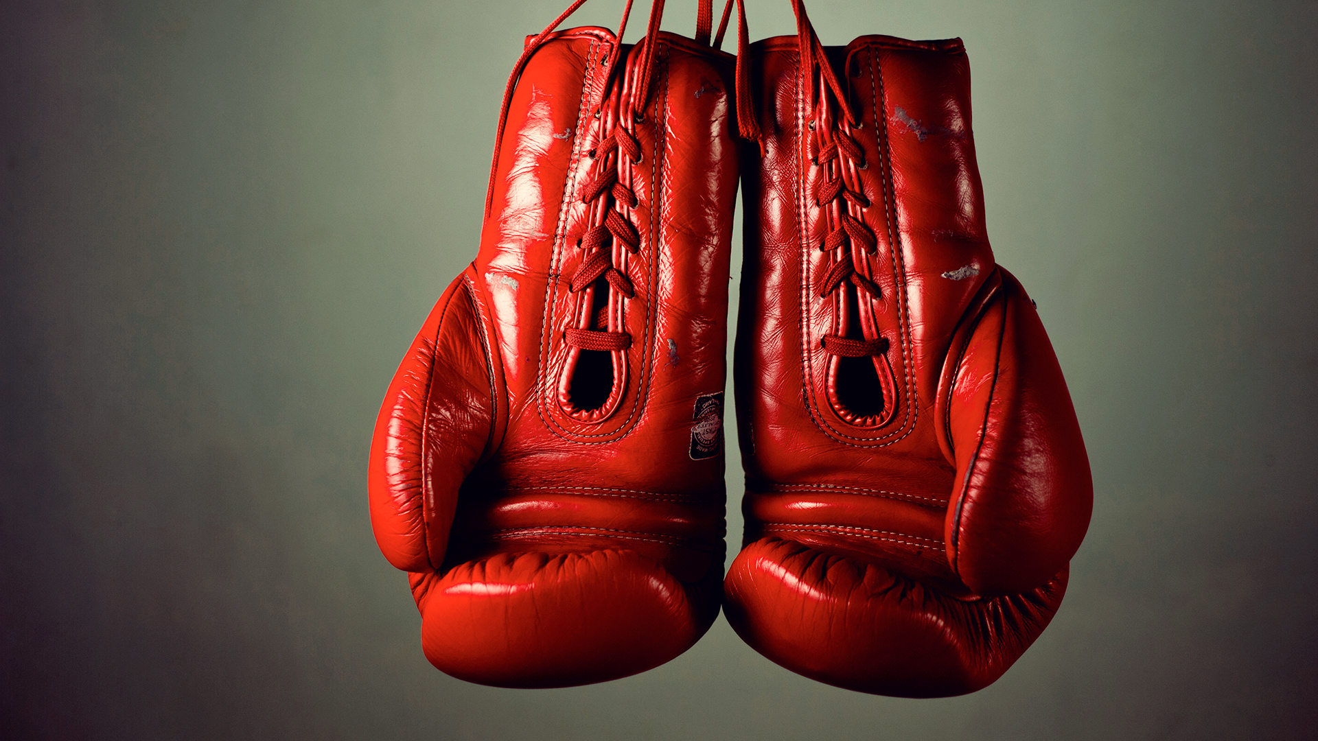 Red hanging boxing gloves, Sports symbol, Powerful image, Fitness inspiration, 1920x1080 Full HD Desktop