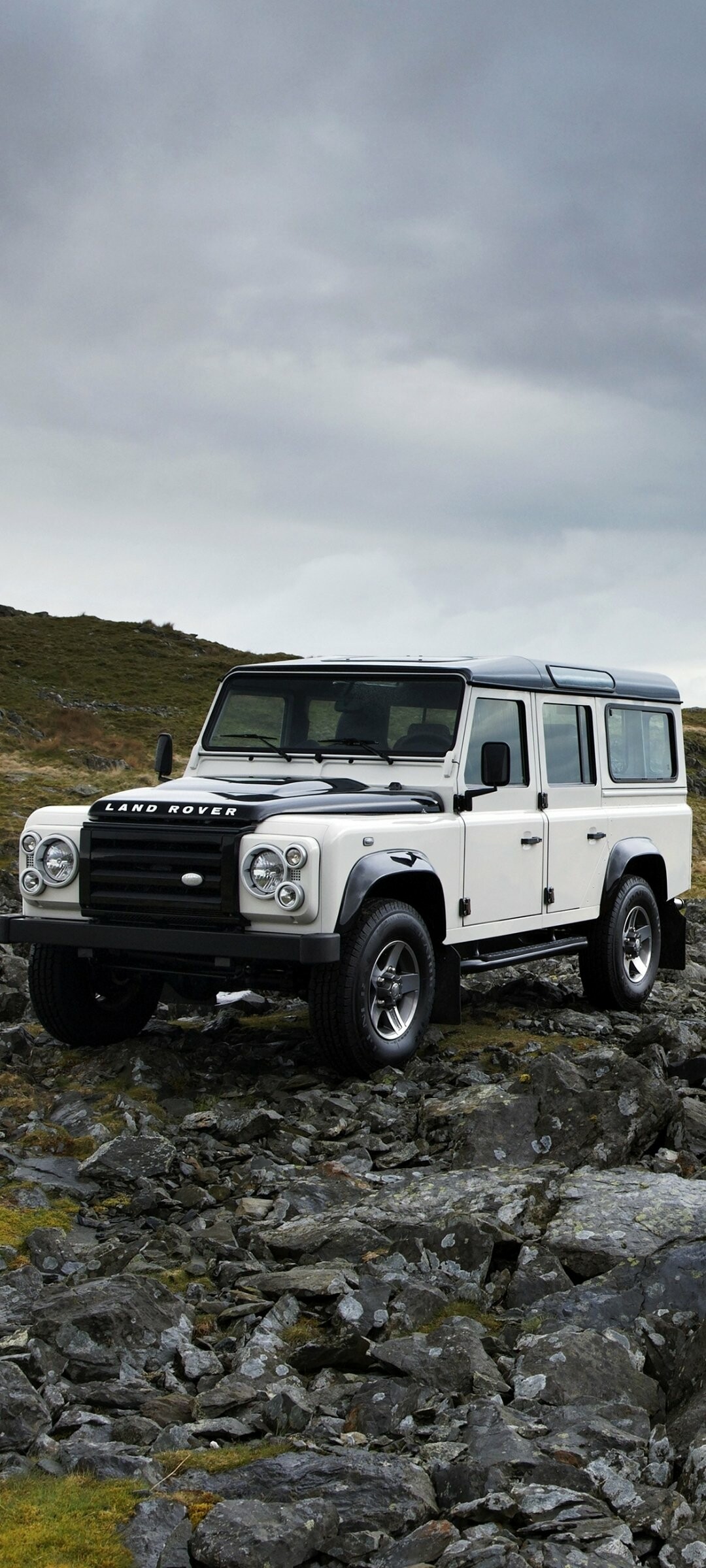 Land Rover: Defender, The first vehicle was officially launched 30 April 1948, at the Amsterdam Motor Show. 1080x2400 HD Background.