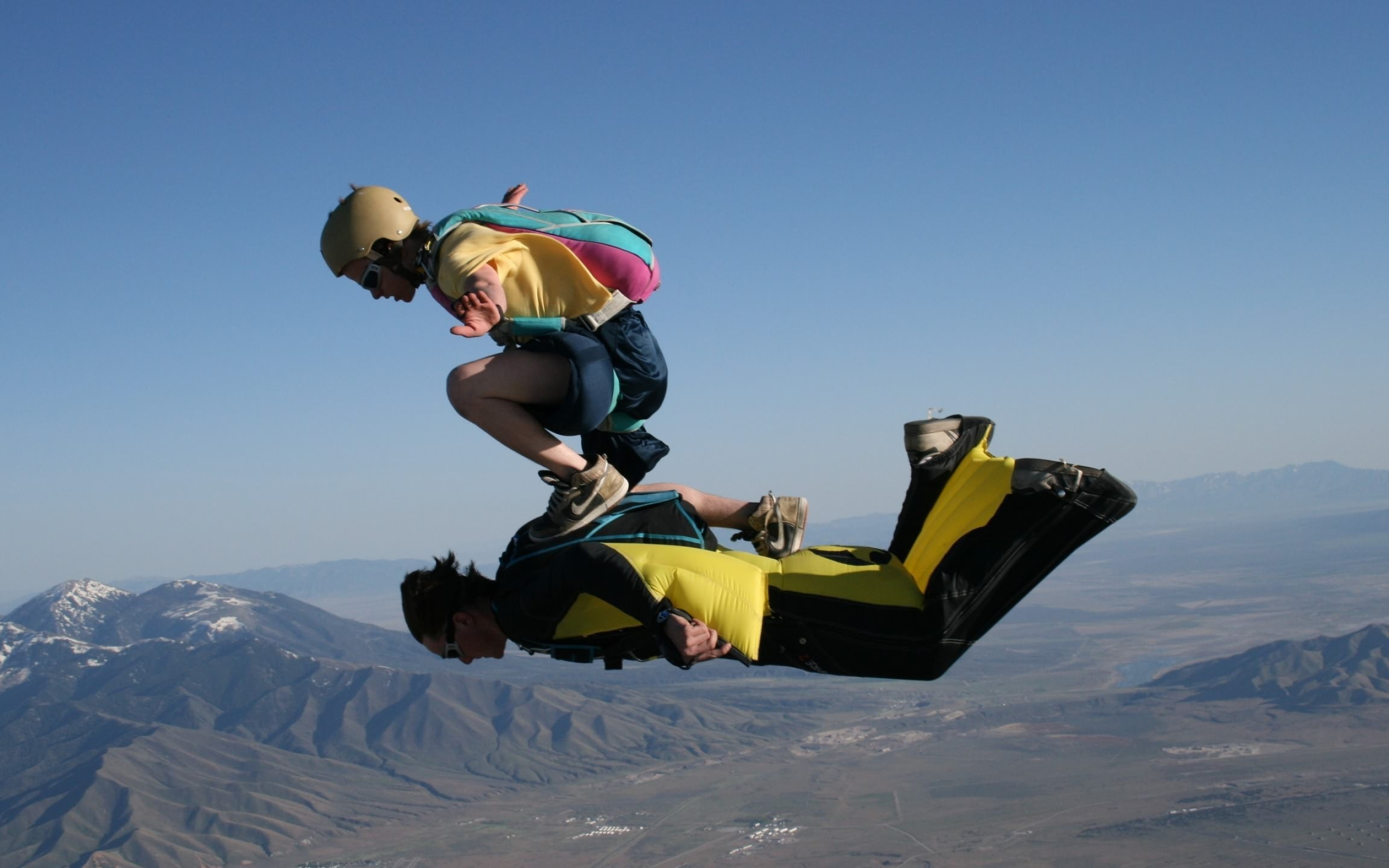 Wingsuit Flying: Tandem wingsuiting formation with a skydiver, Extreme sport performance. 2560x1600 HD Wallpaper.