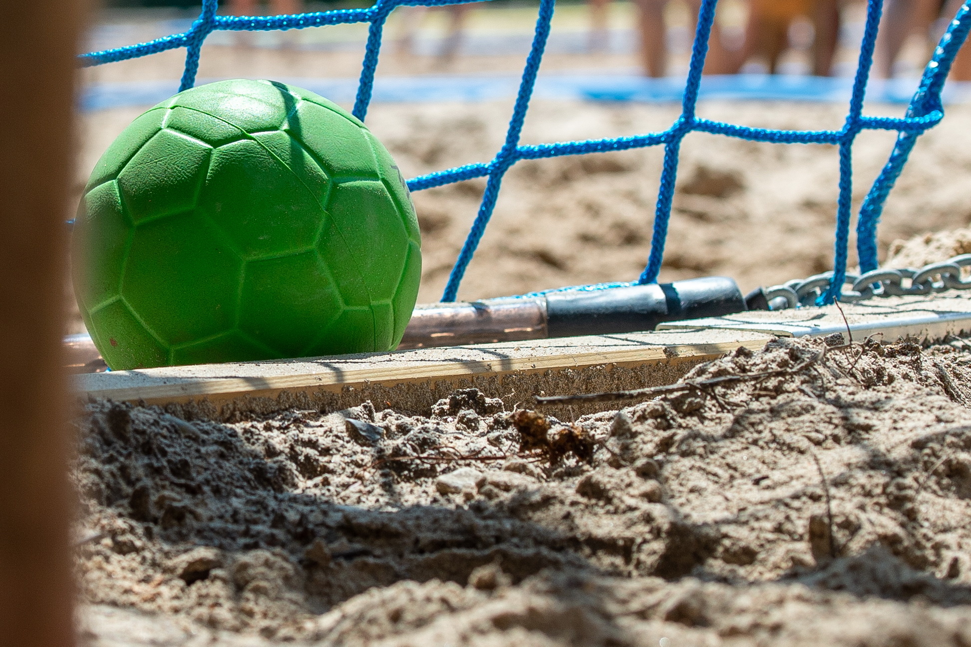 Beach Handball: A ball at the goal, Equipment for a competitive recreational sports discipline. 1950x1300 HD Wallpaper.