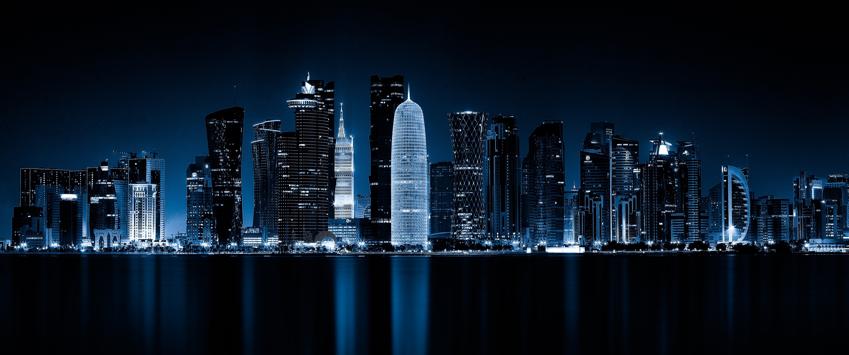 Doha, Qatar 4K wallpaper, Cityscape at night, Modern architecture, 3440x1440 Dual Screen Desktop