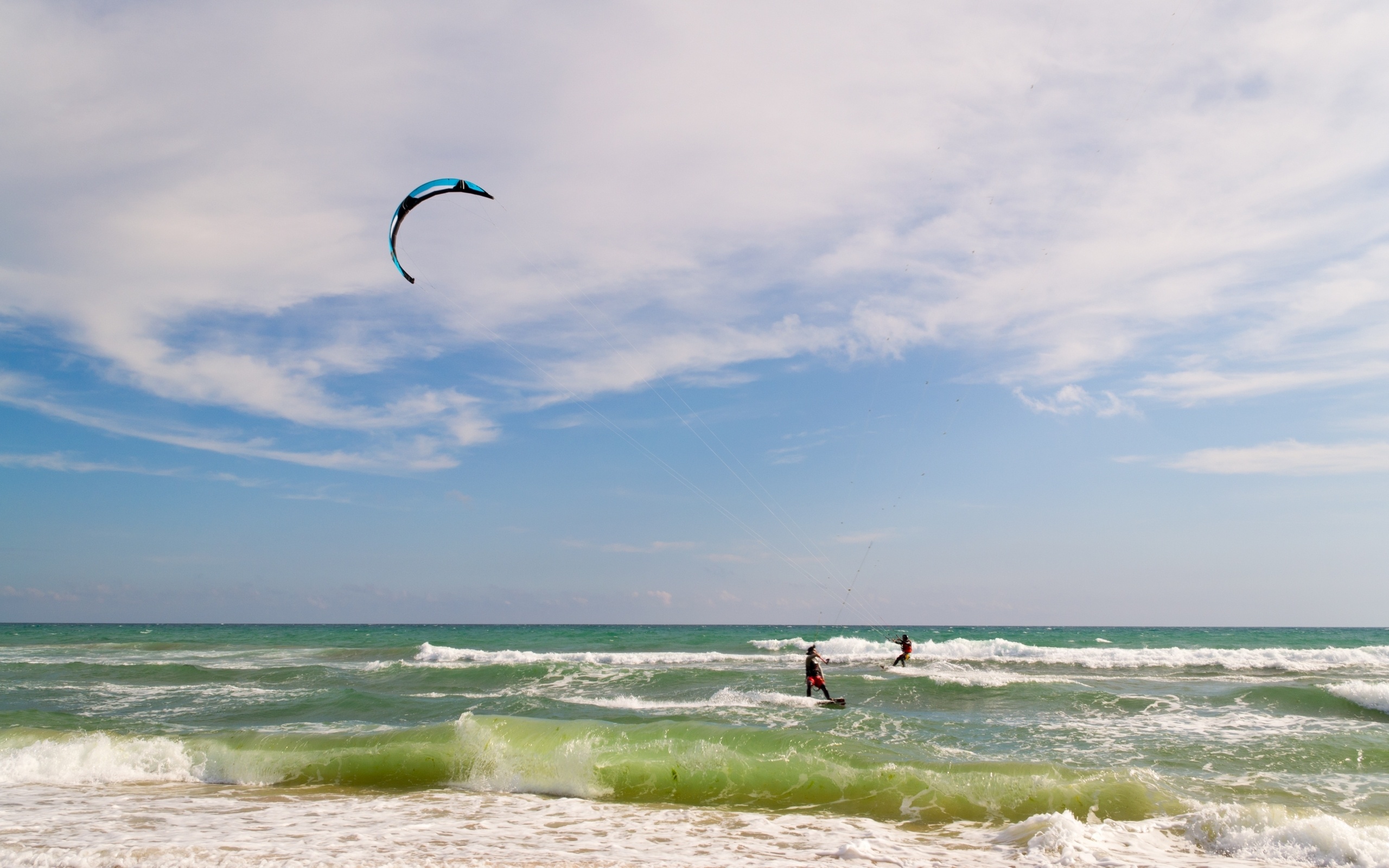 Kiteboarding: Pulling a rider across the sea, A wind-dependent sport, Waves. 2560x1600 HD Background.