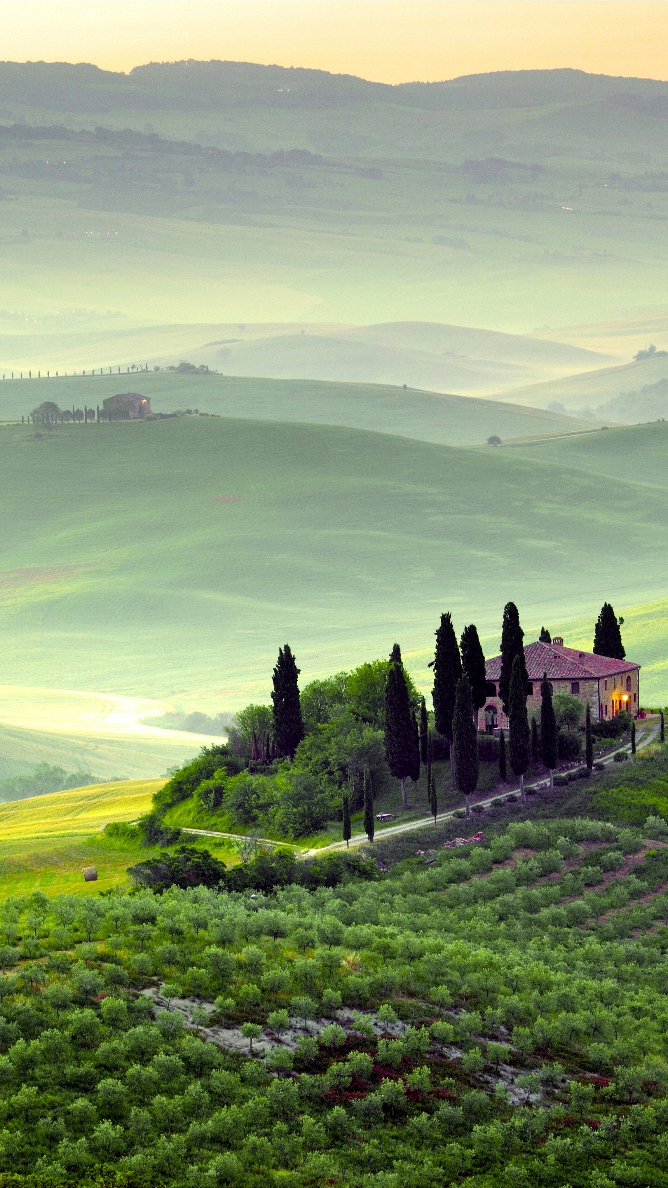 Green Hills: Tuscany region in central Italy, Italian-style country houses surrounded by green fields. 2160x3840 4K Wallpaper.