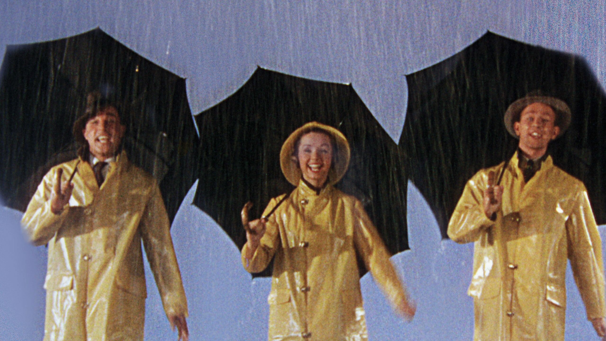 Singin' in the Rain: Donald (Don) Lockwood, Cosmo Brown, and Kathy Selden. 2560x1440 HD Background.
