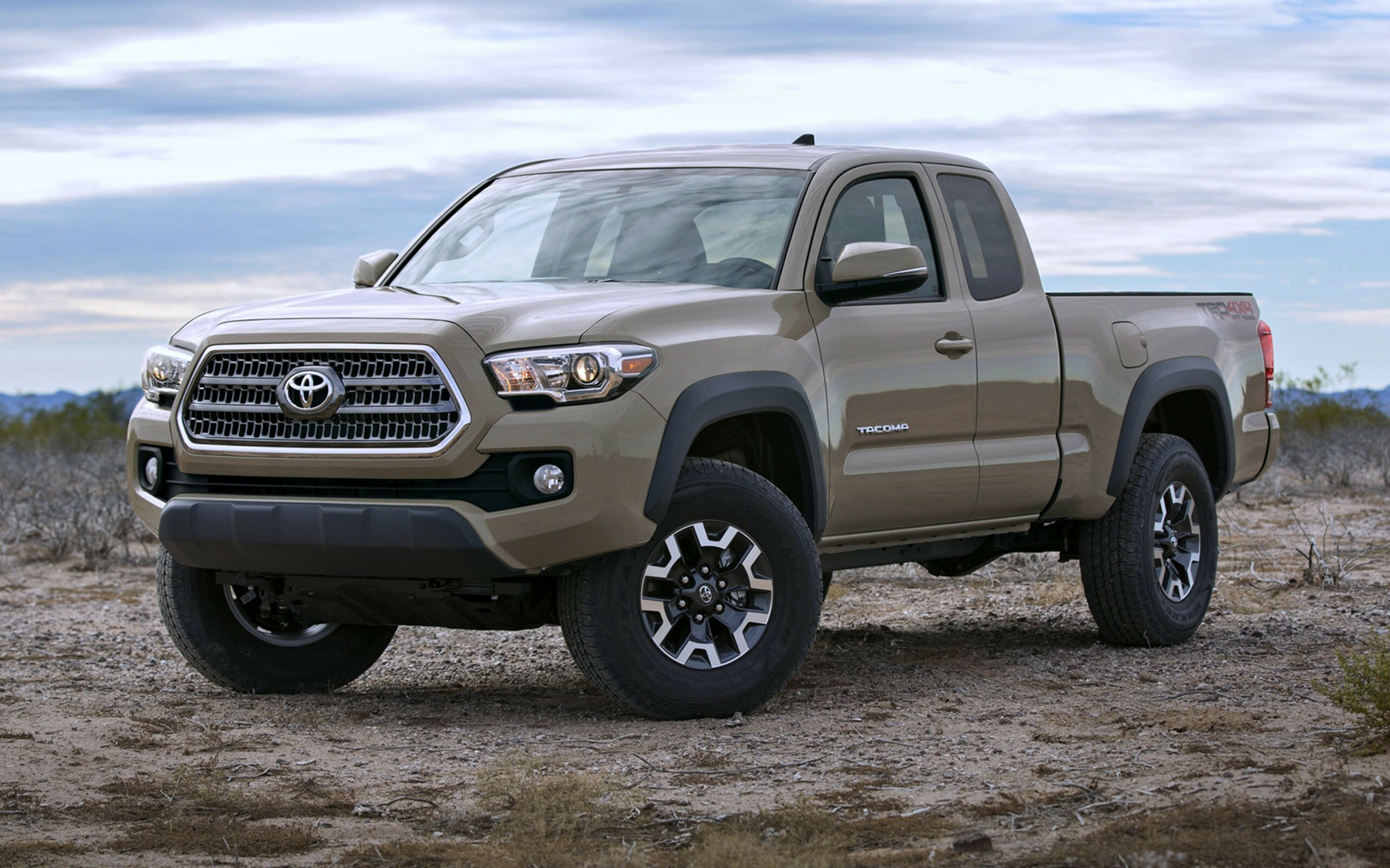 Toyota Tacoma: Pickups, Development began in 1989, following the launch of the fifth-generation Hilux. 2560x1600 HD Background.