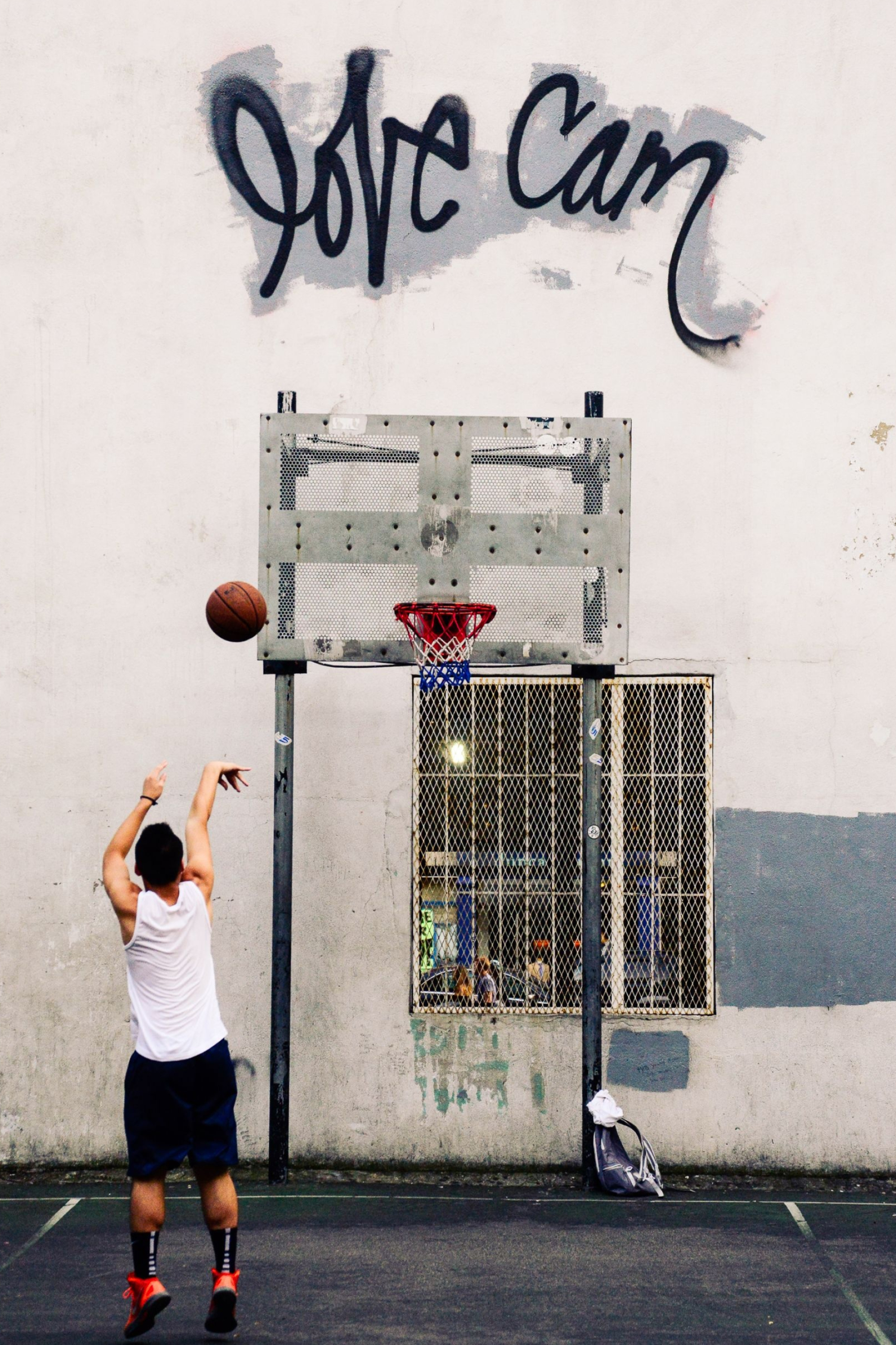 Streetball: 2-point basket training, Urban sports played on asphalt. 2000x3000 HD Wallpaper.