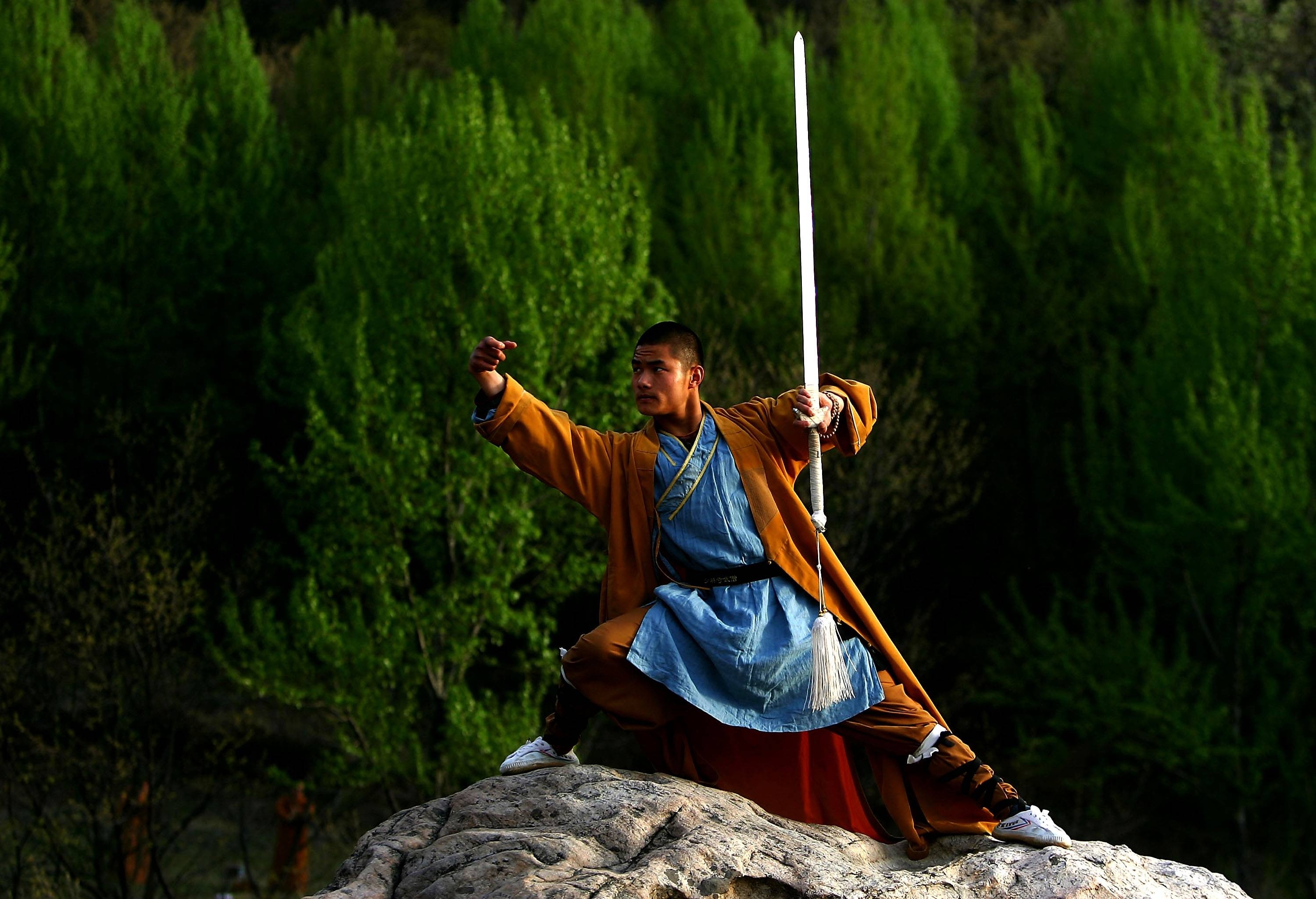 Shaolin Kung Fu: A combat meditation with a sword performed by a Shaolin monk, Chinese martial arts, Sword poses. 3000x2050 HD Background.