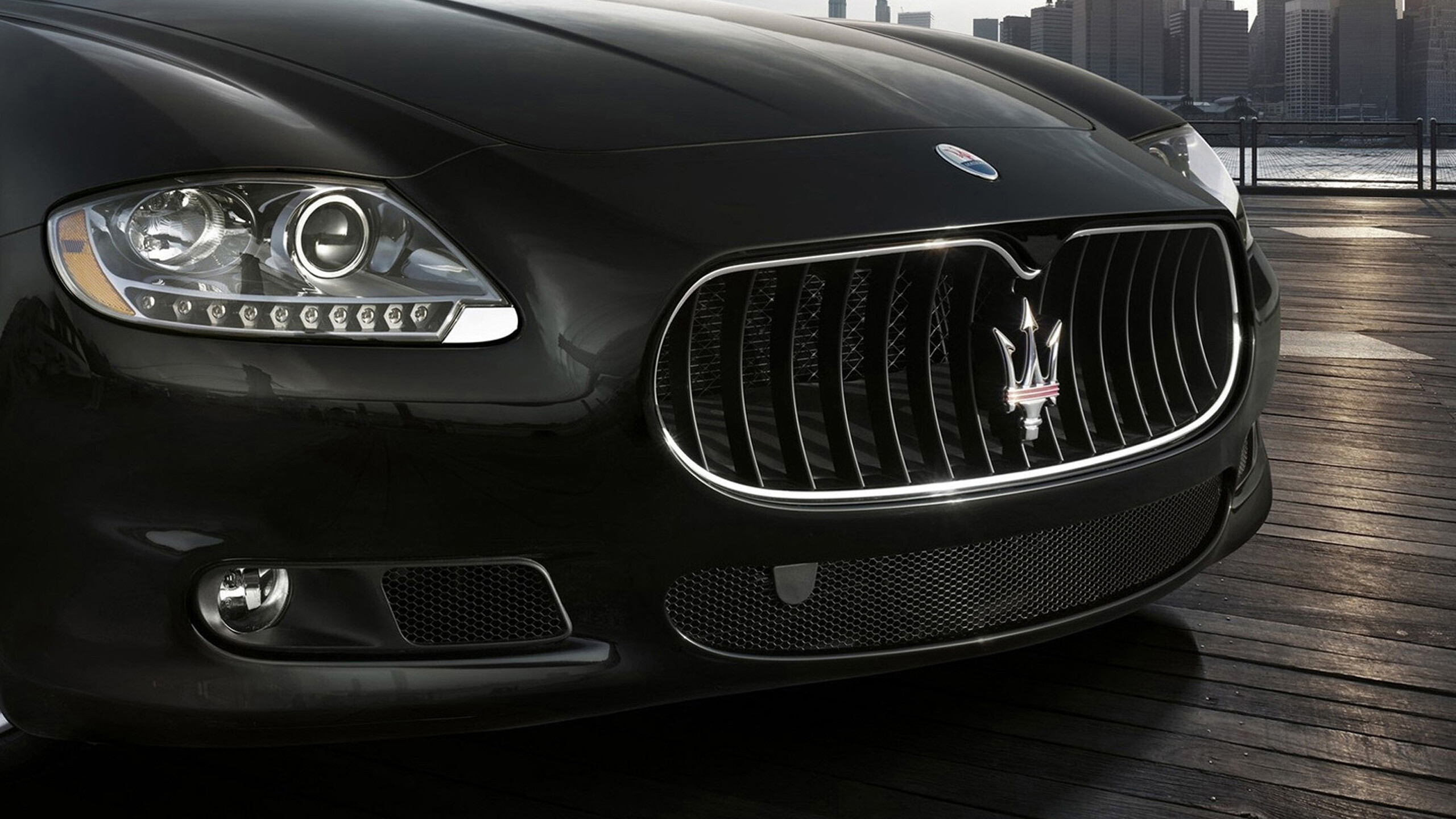 Maserati: Car logo, The company has been owned by Stellantis since 2021. 2560x1440 HD Background.